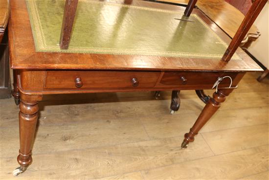 A Victorian mahogany two drawer writing table, with green leather inset top W.111cm A Victorian mahogany two drawer writing table, with green leather inset top W.111cm