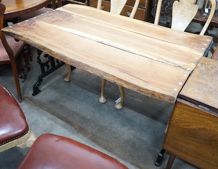 A Victorian style cast metal garden table with waney edged oak plank top, length 122cm, depth 76cm, height 68cm