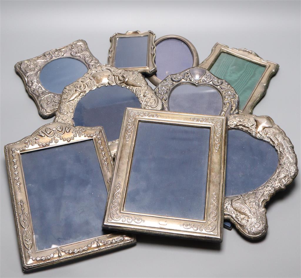 Nine assorted modern silver mounted photograph frames, largest 24.3cm.
