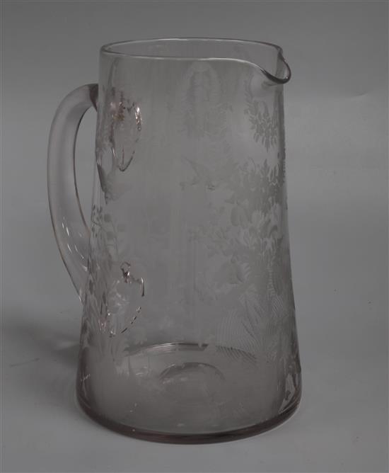 A Stourbridge glass jug engraved with birds, leafy swags and flowers height 20cm A Stourbridge glass jug engraved with birds, leafy swags and flowers height 20cm