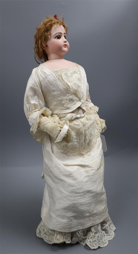 A French fashion doll, late 19th century, probably Jumeau or Gaultier, H.51cm A French fashion doll, late 19th century, probably Jumeau or Gaultier, H.51cm