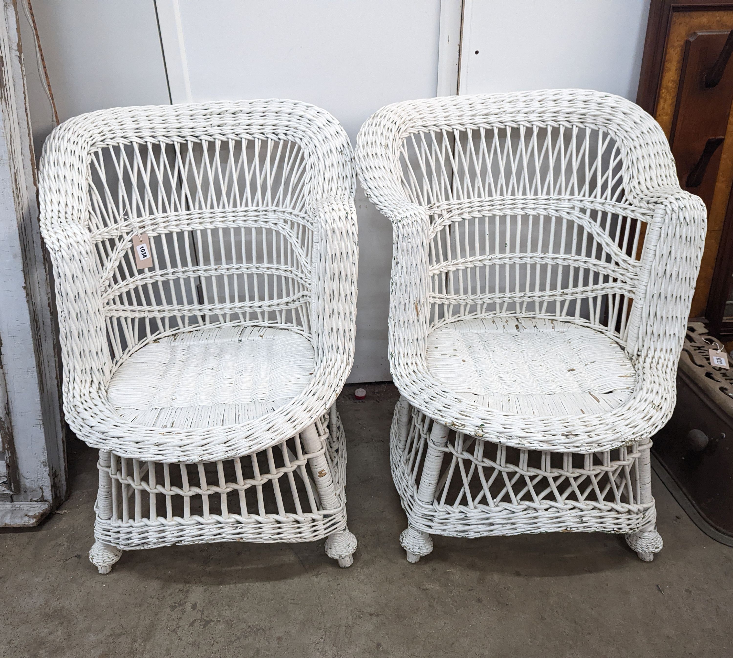 A pair of painted rattan conservatory chairs, width 65cm, height 79cm