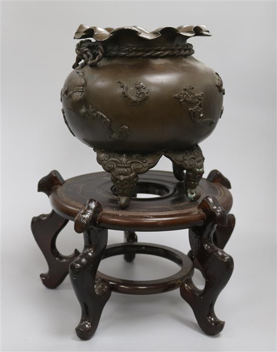 A Japanese bronze incense burner and stand A Japanese bronze incense burner and stand