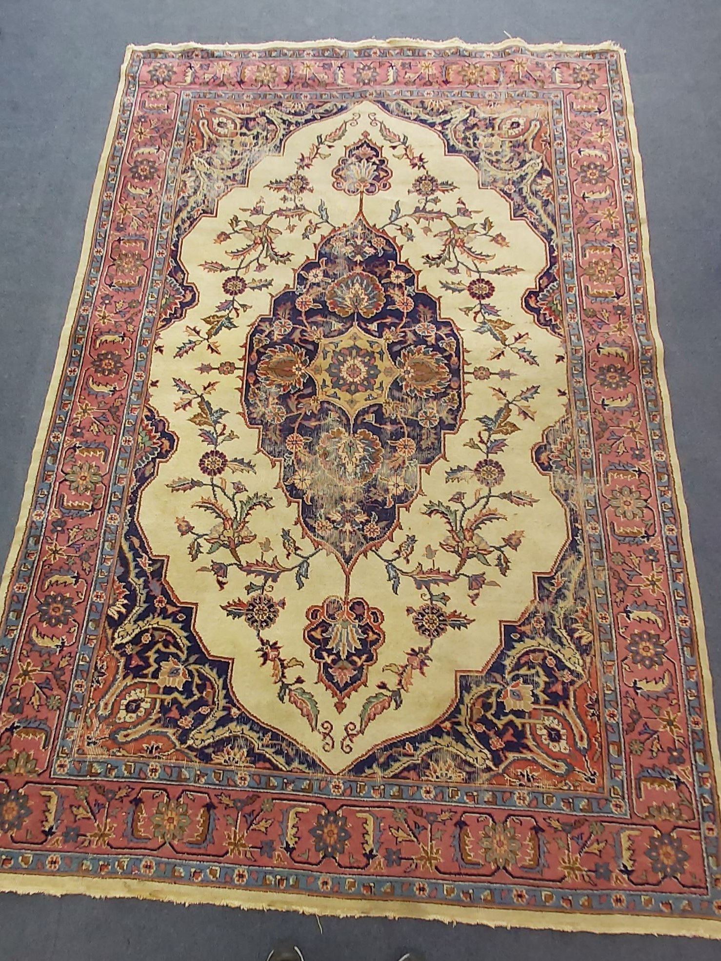 A North West Persian carpet with a central floral medallion, 310 x 197cm