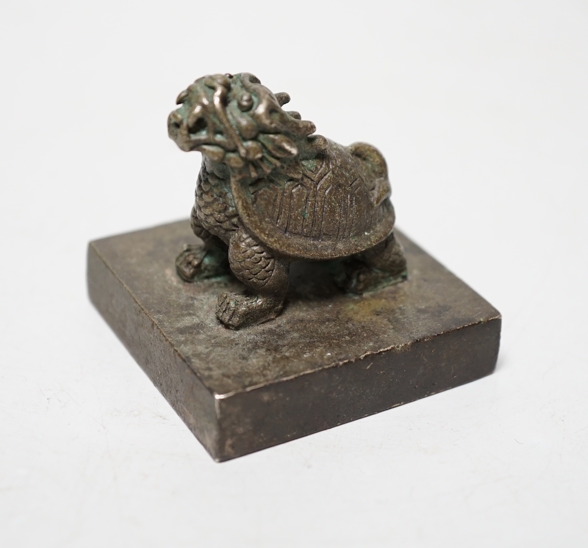 A Chinese bronze ‘Lónggui’ (dragon turtle) seal, 5cm                                                                                                                                                                        