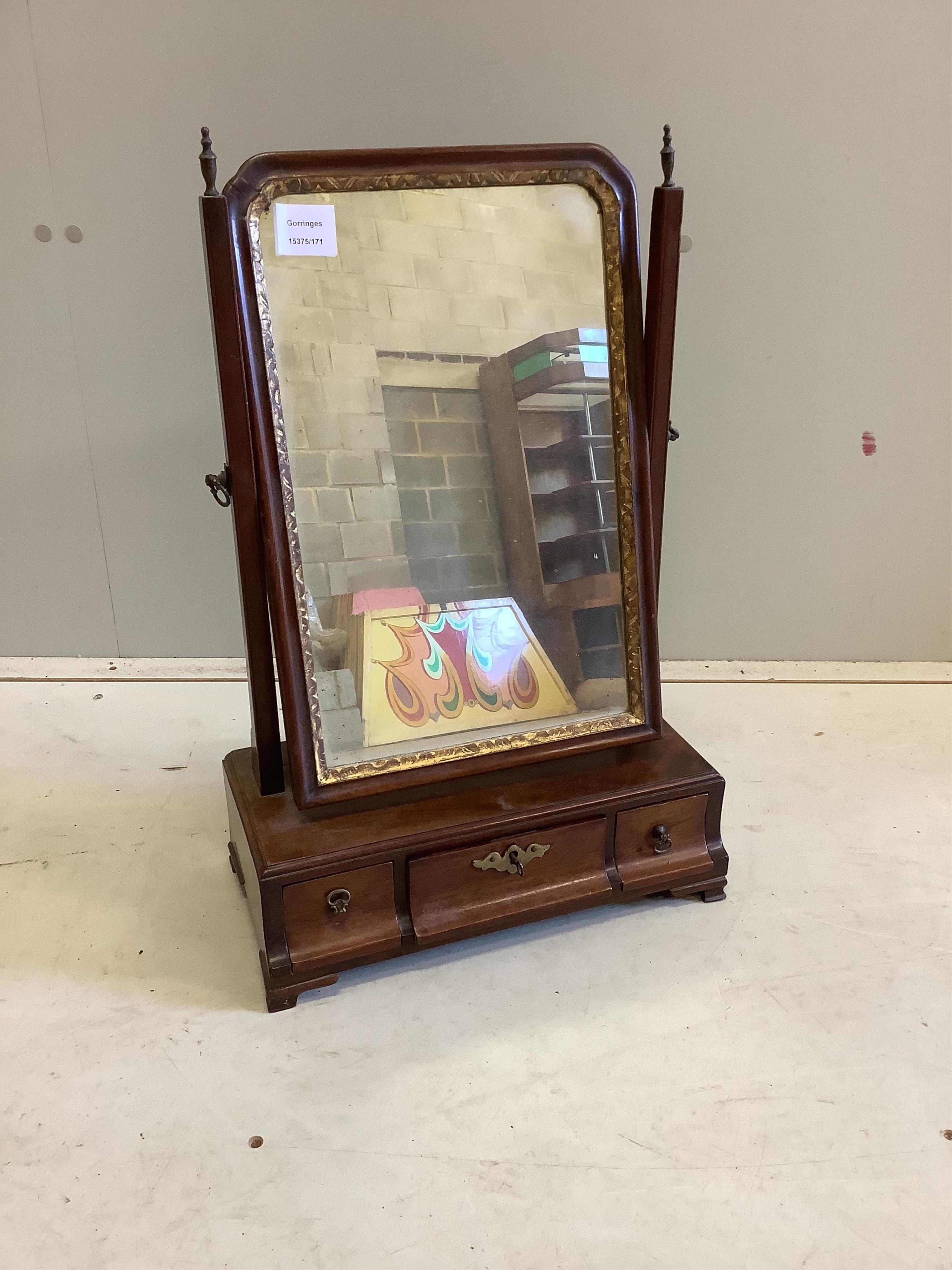 A George III mahogany toilet mirror, width 37cm, depth 19cm, height 57cm. Condition - fair                                                                                                                                  