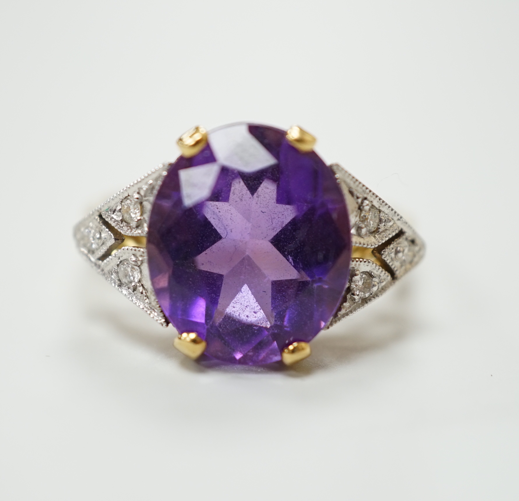 A 9K gold amethyst and diamond dress ring, size N                                                                                                                                                                           