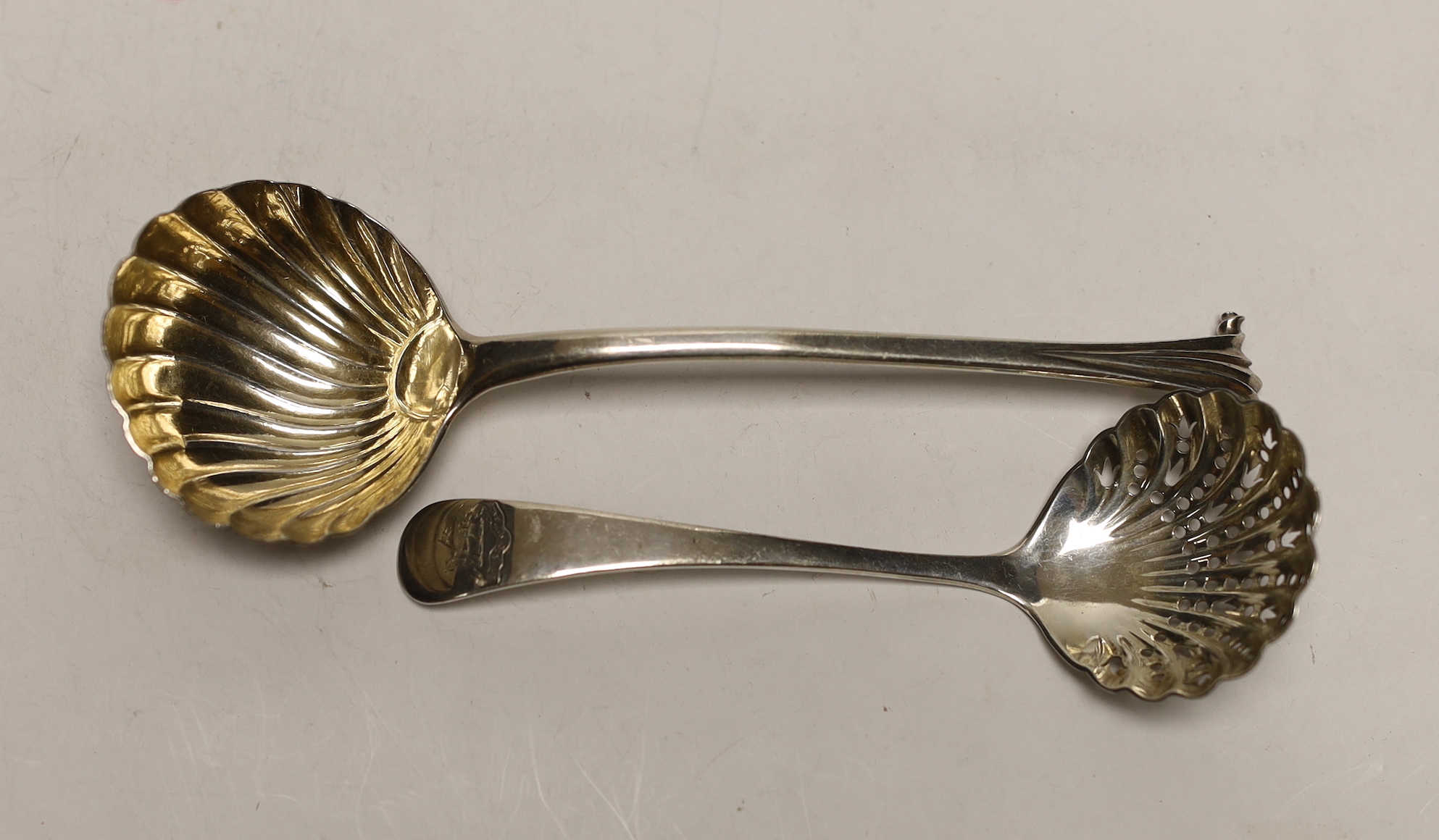 A George II silver Onslow pattern sauce ladle, London 1741, 16.7cm and a Victorian sifter spoon, Edward Hutton, London, 1889, 71 grams.                                                                                     