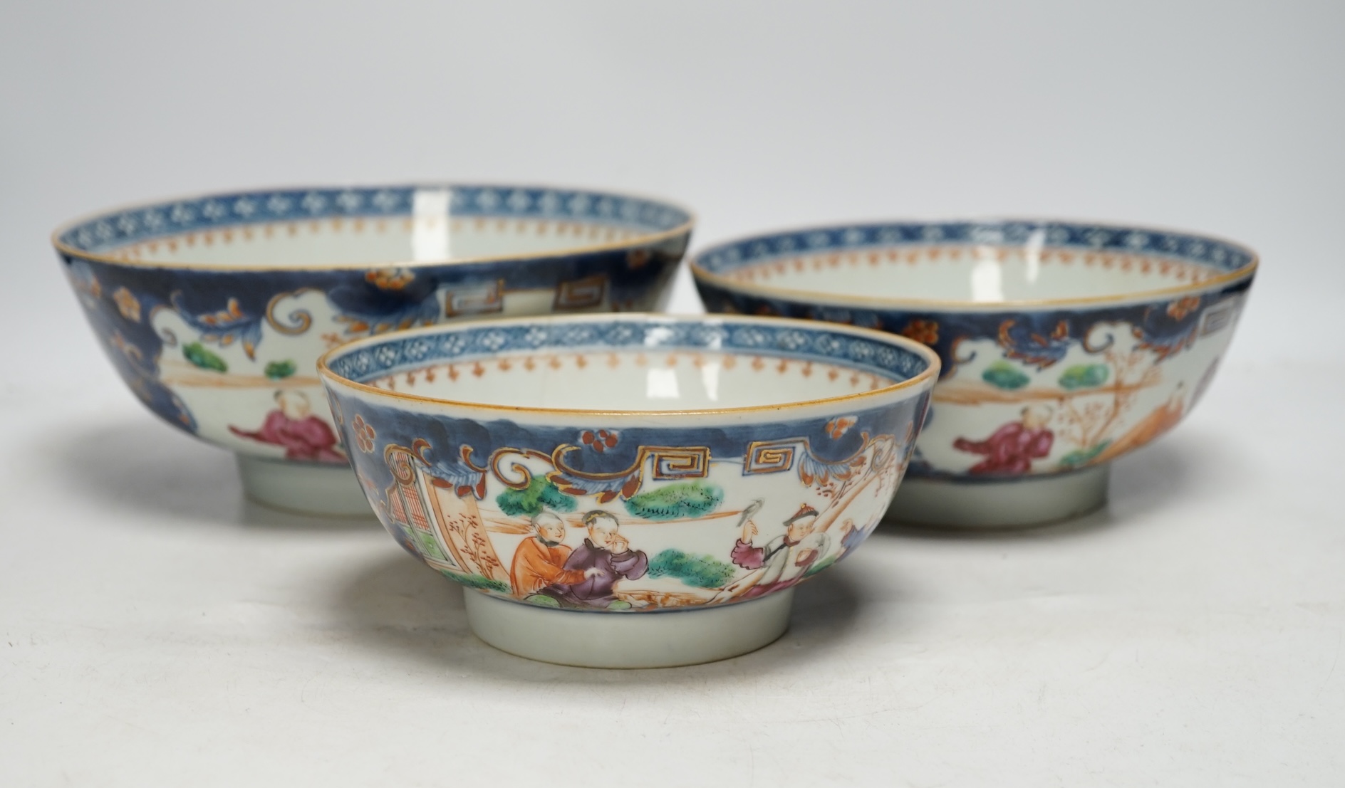 A set of three graduated 18th century Chinese export porcelain bowls, largest 23cm in diameter. Condition - two good, smallest example cracked                                                                              