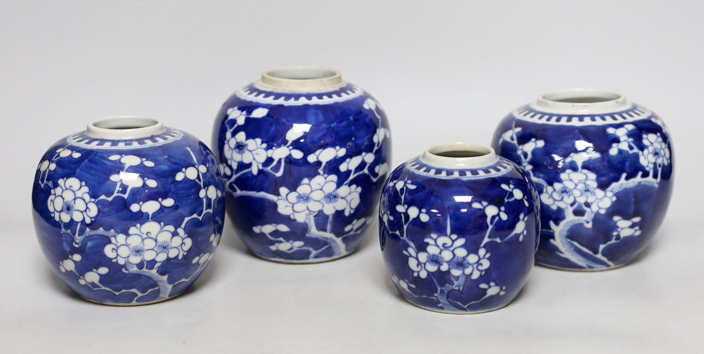 Four Chinese blue and white ‘prunus’ jars, tallest 14cms high                                                                                                                                                               