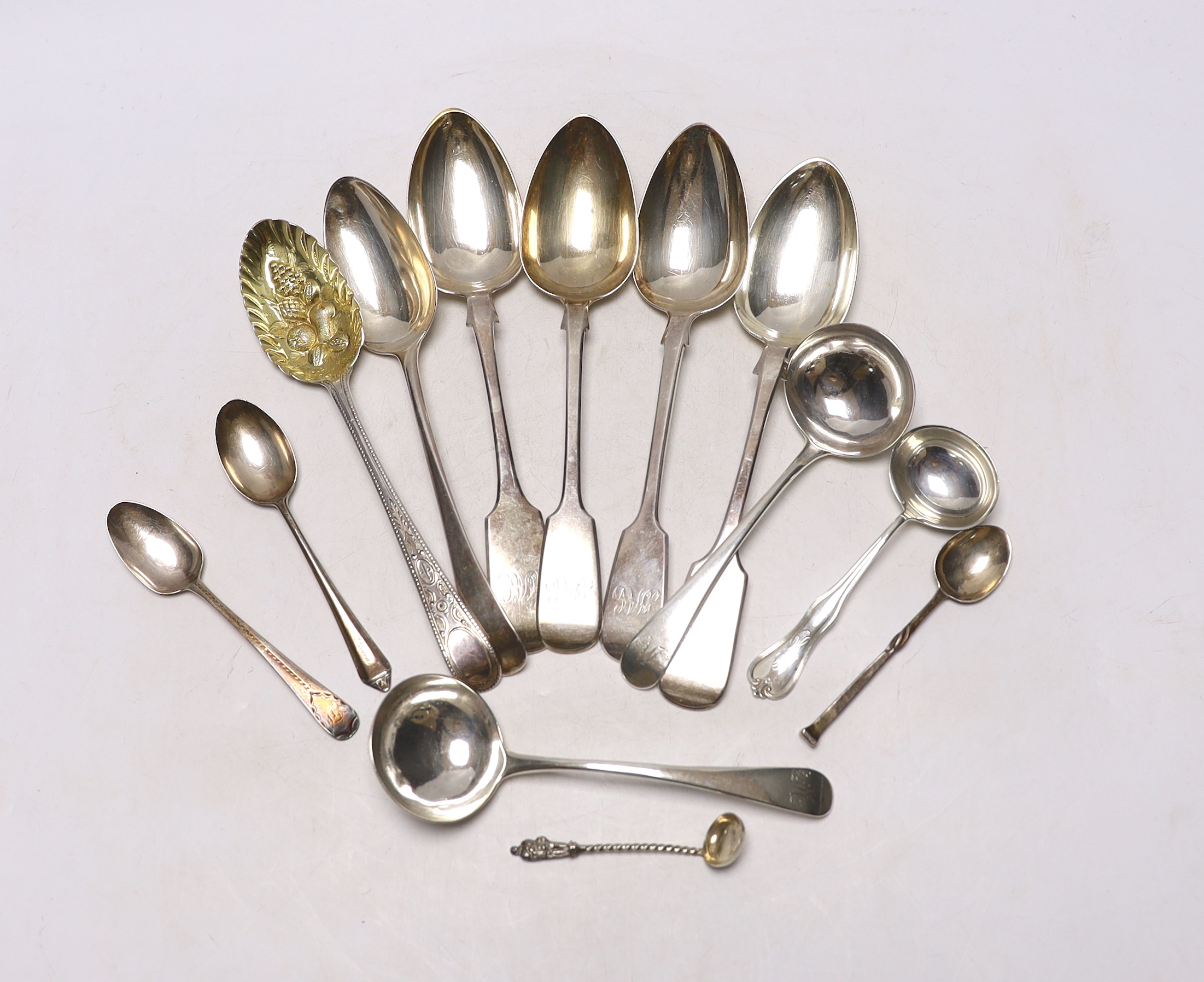 A George III Old English pattern berry spoon, maker George Smith (III), London 1777 and twelve other items of silver or sterling flatware, including a pair of Exeter fiddle pattern tablespoons, 18.3oz.                   