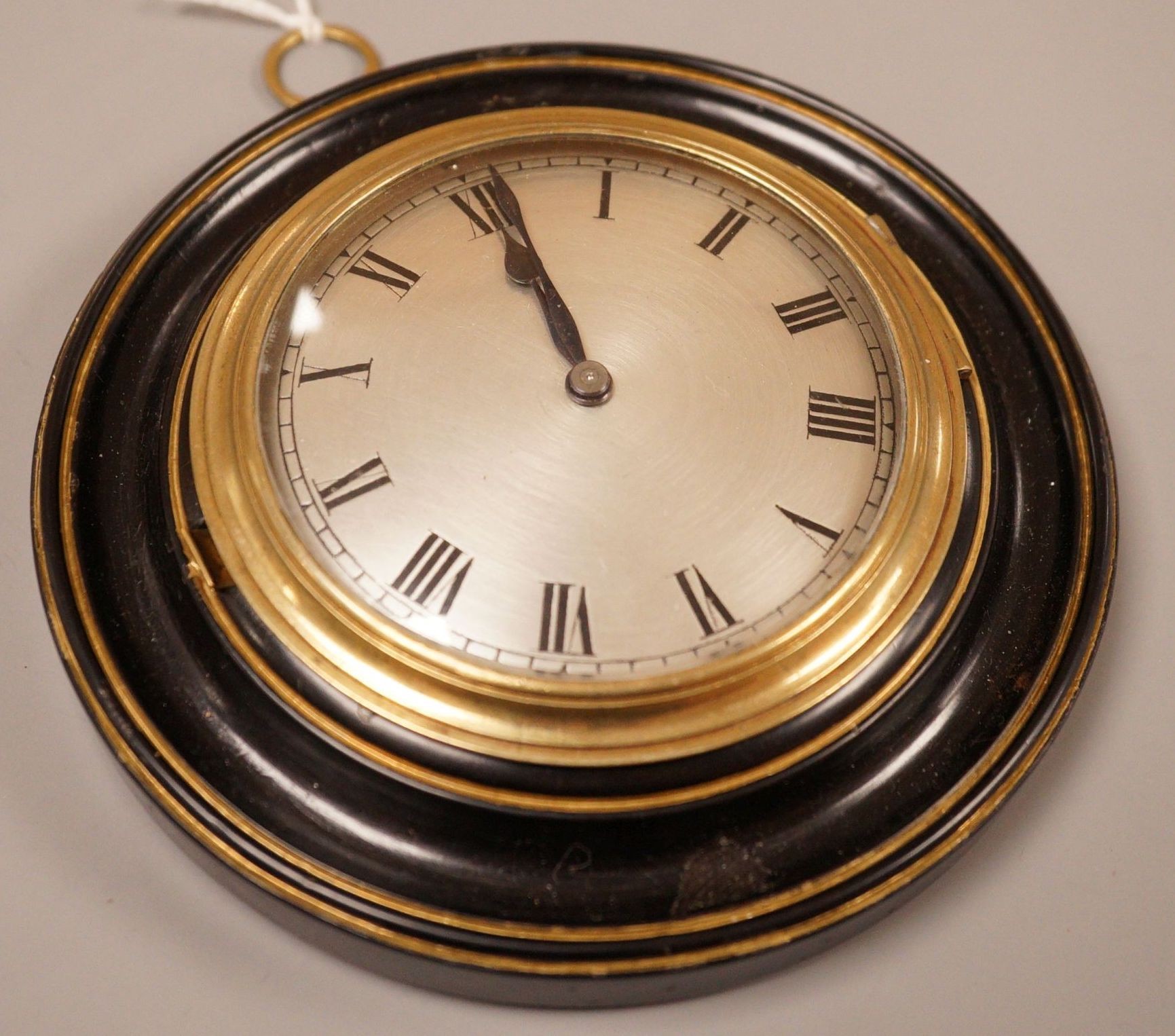 A George III brass and ebonised wood sedan timepiece, 1£cm diameter                                                                                                                                                         