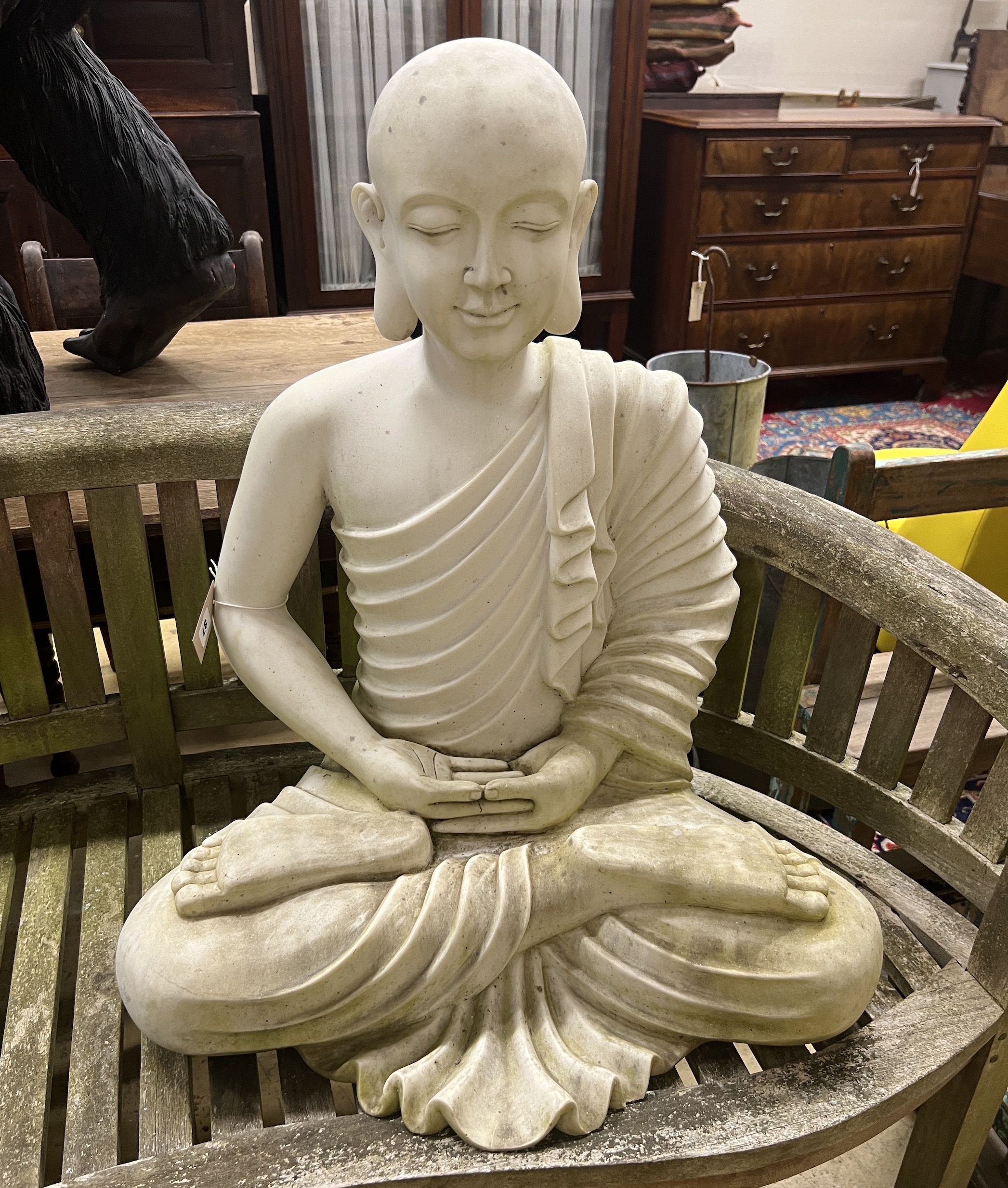 A composition faux marble seated Buddha garden ornament, height 74cm                                                                                                                                                        