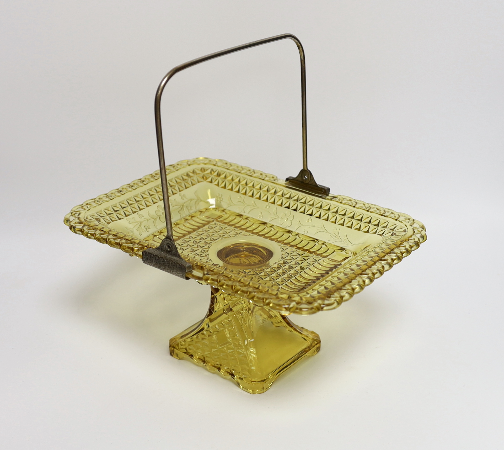 An American amber pressed glass comport/basket with swing handle, probably Pittsburg, 27cm wide                                                                                                                             