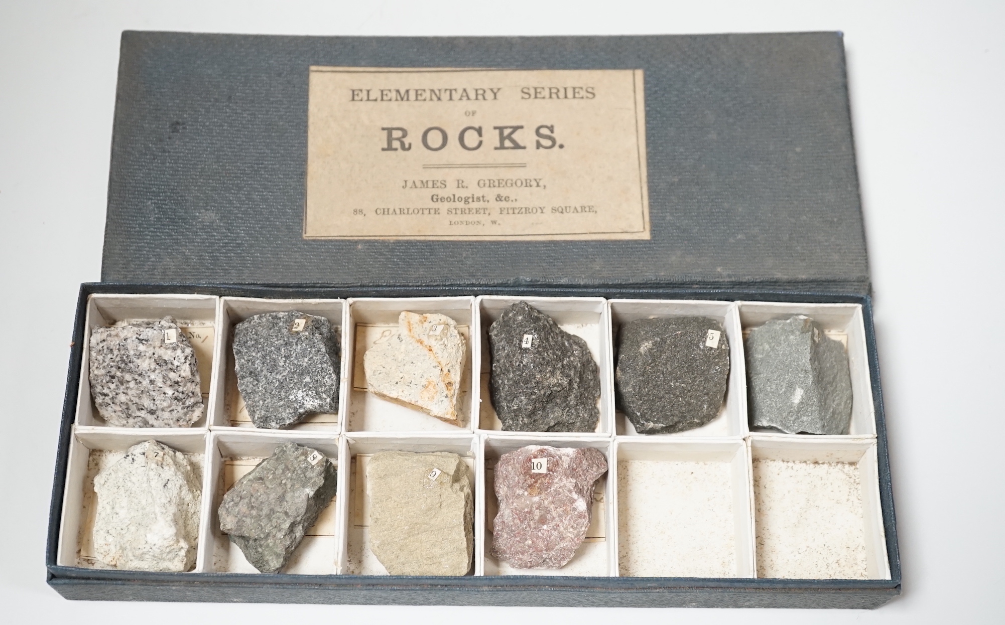 James R. Gregory. Elementary rocks and rock formed minerals, a collection divided between five labelled boxes, in a four drawer desk top filing case                                                                        