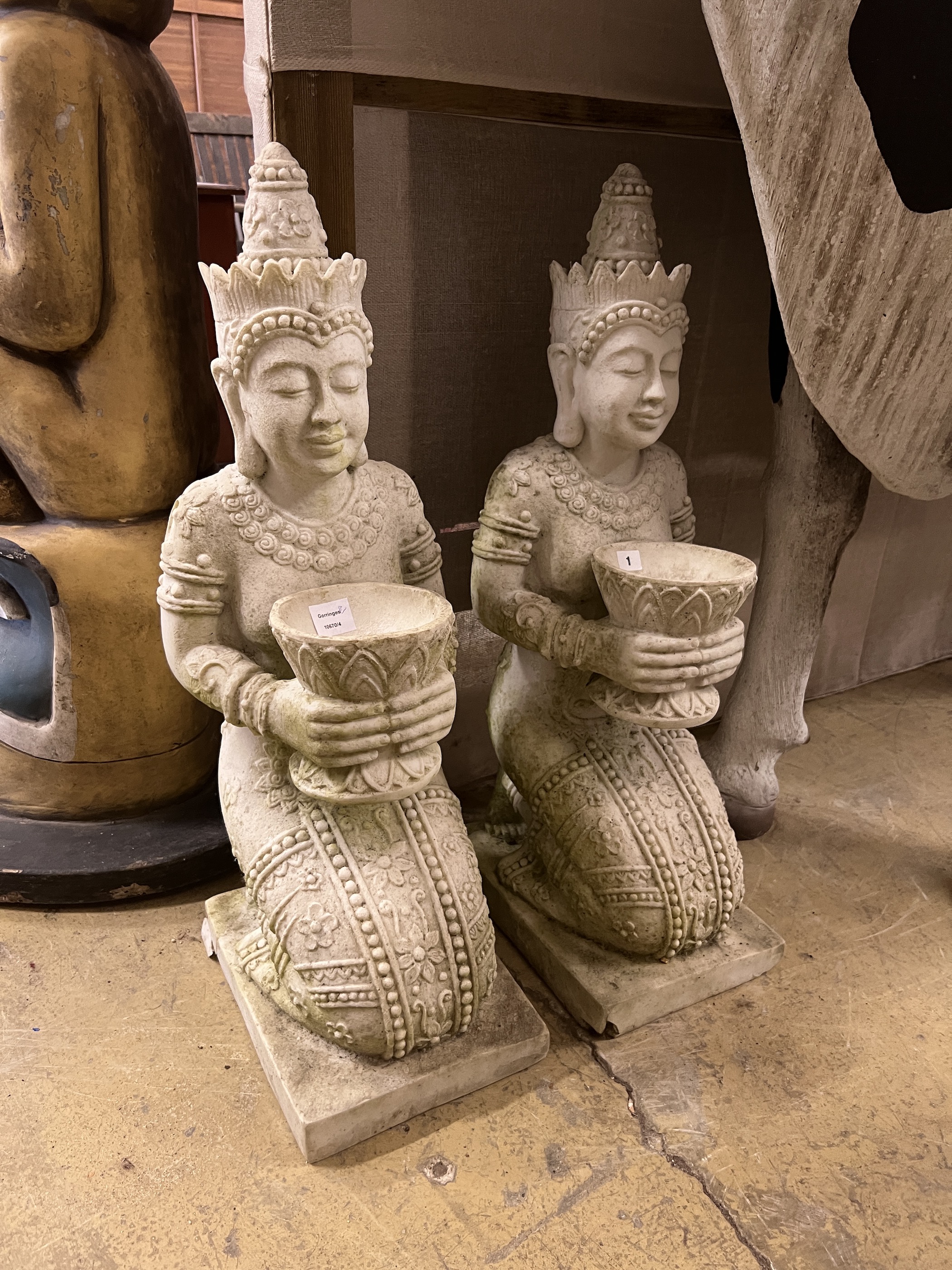 A pair of Thai style composition faux marble kneeling attendant garden ornaments, height 85cm                                                                                                                               