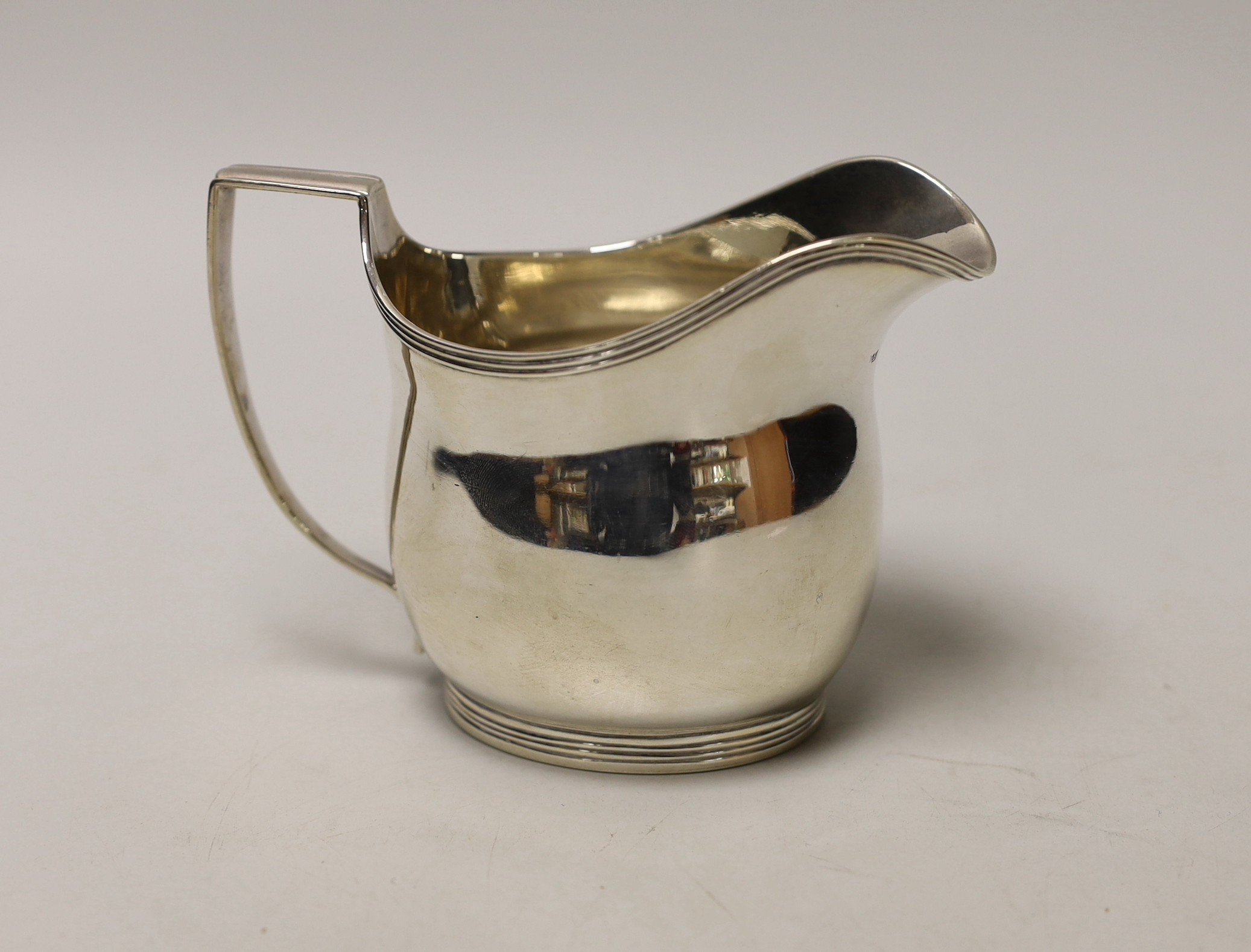 A George III silver helmet shaped cream jug, London, 1810, 10cm, 5.8oz.                                                                                                                                                     