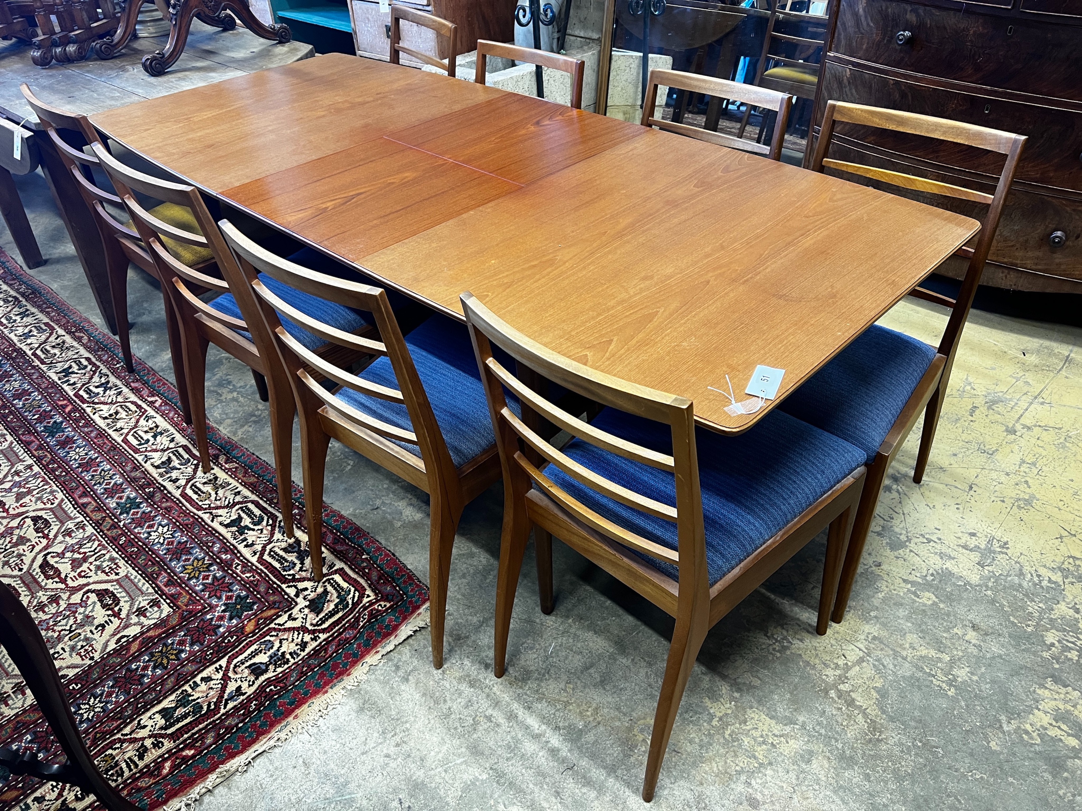 A. H. McIntosh & Co. a Dunvegan teak extending dining table and eight chairs designed by Tom Robertson, table length 193cm extended, depth 83cm, height 74cm                                                                