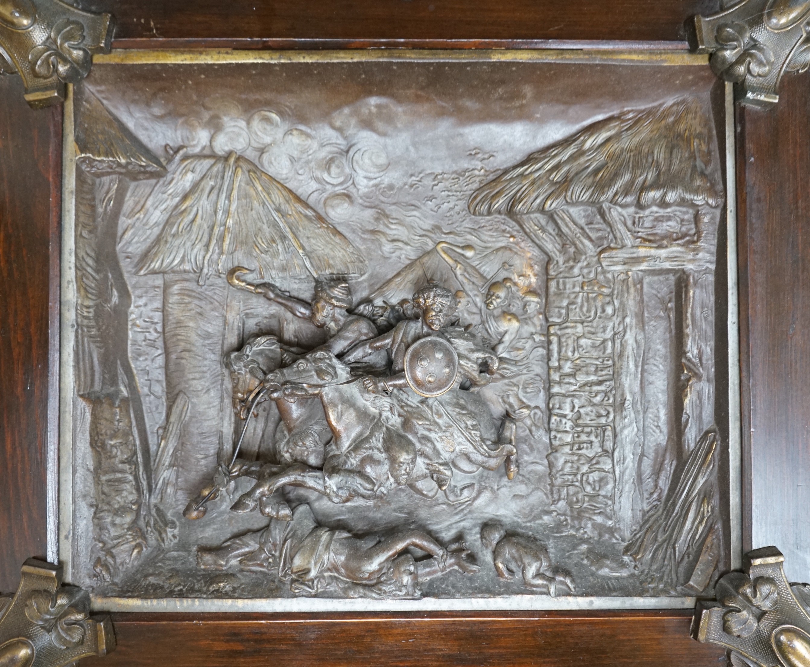 A framed spelter relief plaque, of the Mongols in battle, 59cm wide, 51 cm high, including frame                                                                                                                            