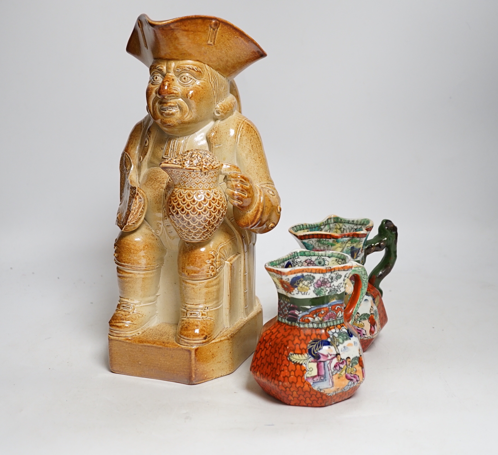 Sundry ceramics including pair of Masons Ironstone jugs, two Toby jugs and faience glazed armorial jug                                                                                                                      