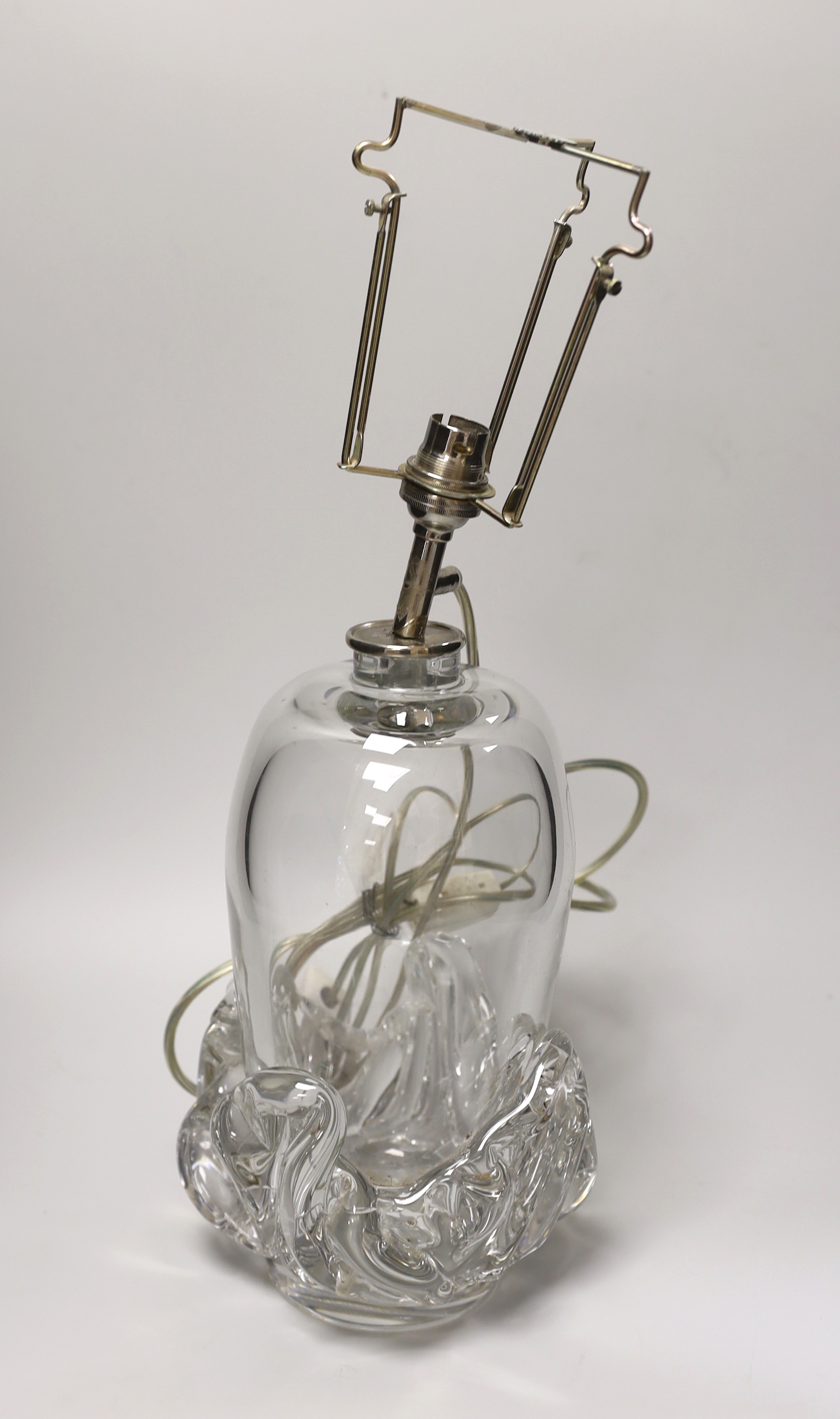 A Daum clear glass table lamp, 28cms high not including light fitting                                                                                                                                                       