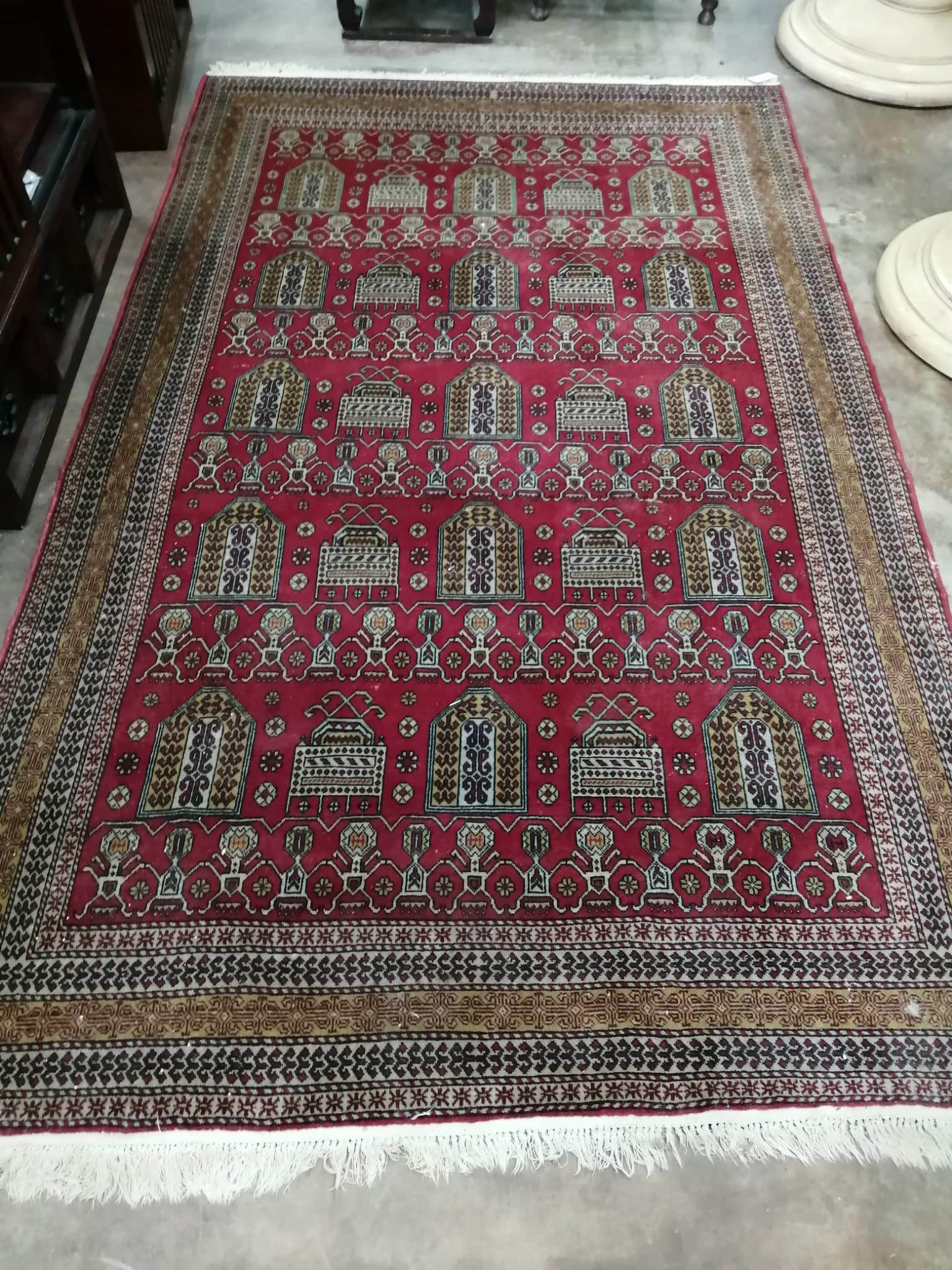 An Azerbaijan red ground rug, circa 1920, 240 x 150cm                                                                                                                                                                       