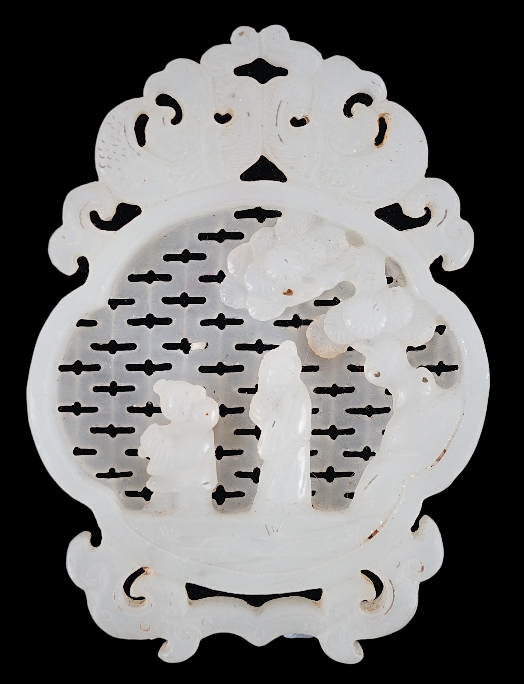 A Chinese white jade reticulated plaque, 19th century, 10.2cm high                                                                                                                                                          