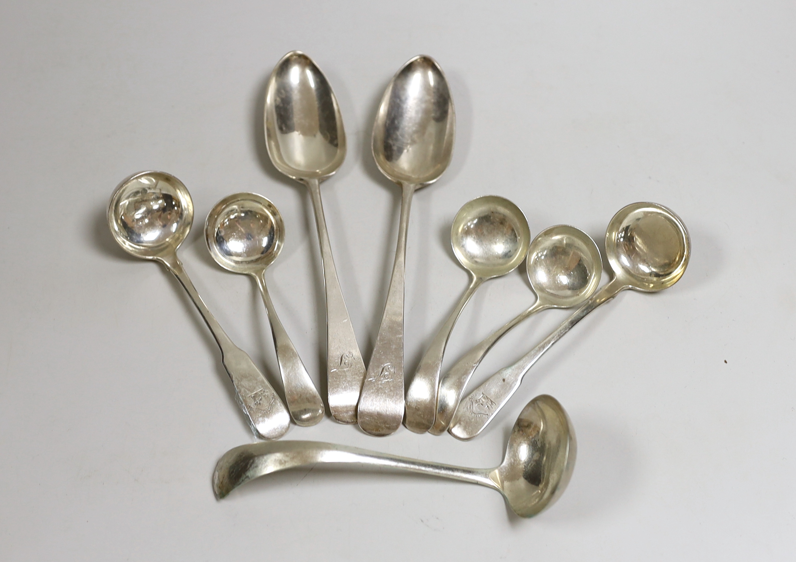 A small selection of Georgian and later silver to include six small ladles, including Dutch white metal and a pair of George III Old English pattern silver table spoons, London, 1788, 10.4oz.                             