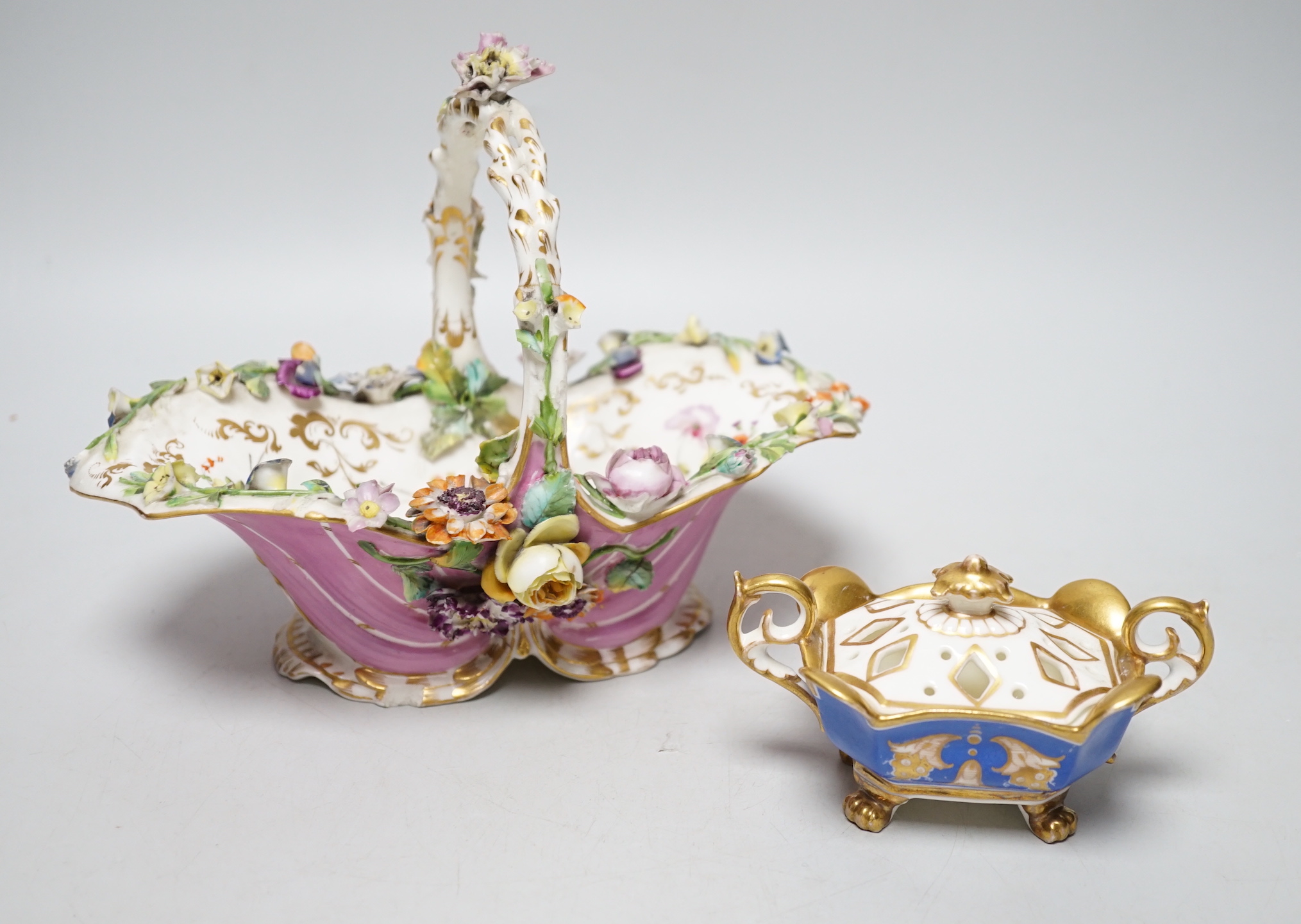A Grainger Lee and co. miniature pot pourri vase with pierced cover, decorated with a view of Worcester Cathedral and the River Severn, on a blue ground, with two scroll handles and four paw feet and a Coalbrookdale flor