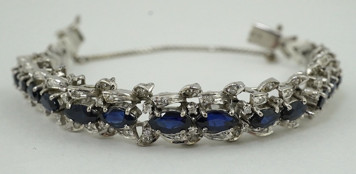 A modern white metal, synthetic? sapphire and diamond chip set bracelet, approx. 17cm. Condition - fair to good                                                                                                             