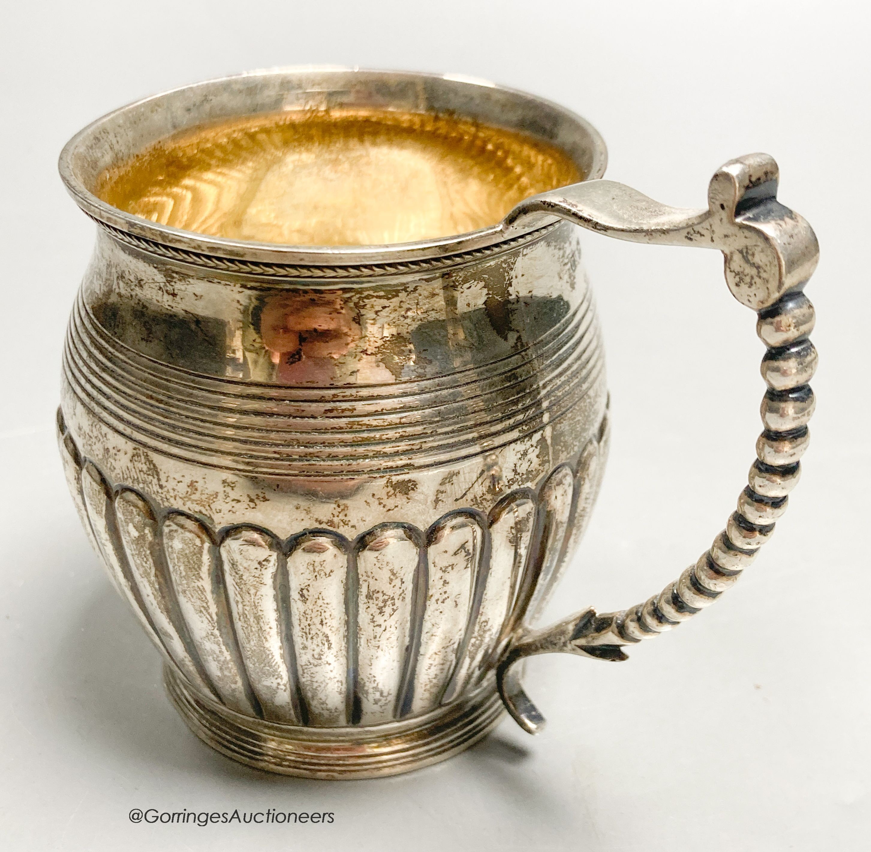 A late George III demi fluted silver christening mug, Crispin Fuller?, London 1818, 85mm, 3.5oz.                                                                                                                            