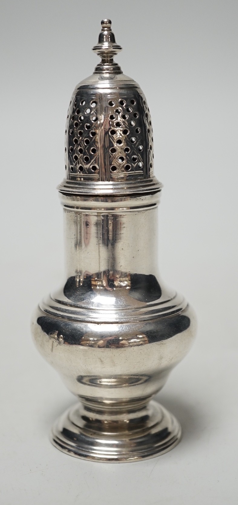 A George II silver baluster pepperette, Samuel Wood, London, 1751, 12.2cm, 90 grams.                                                                                                                                        