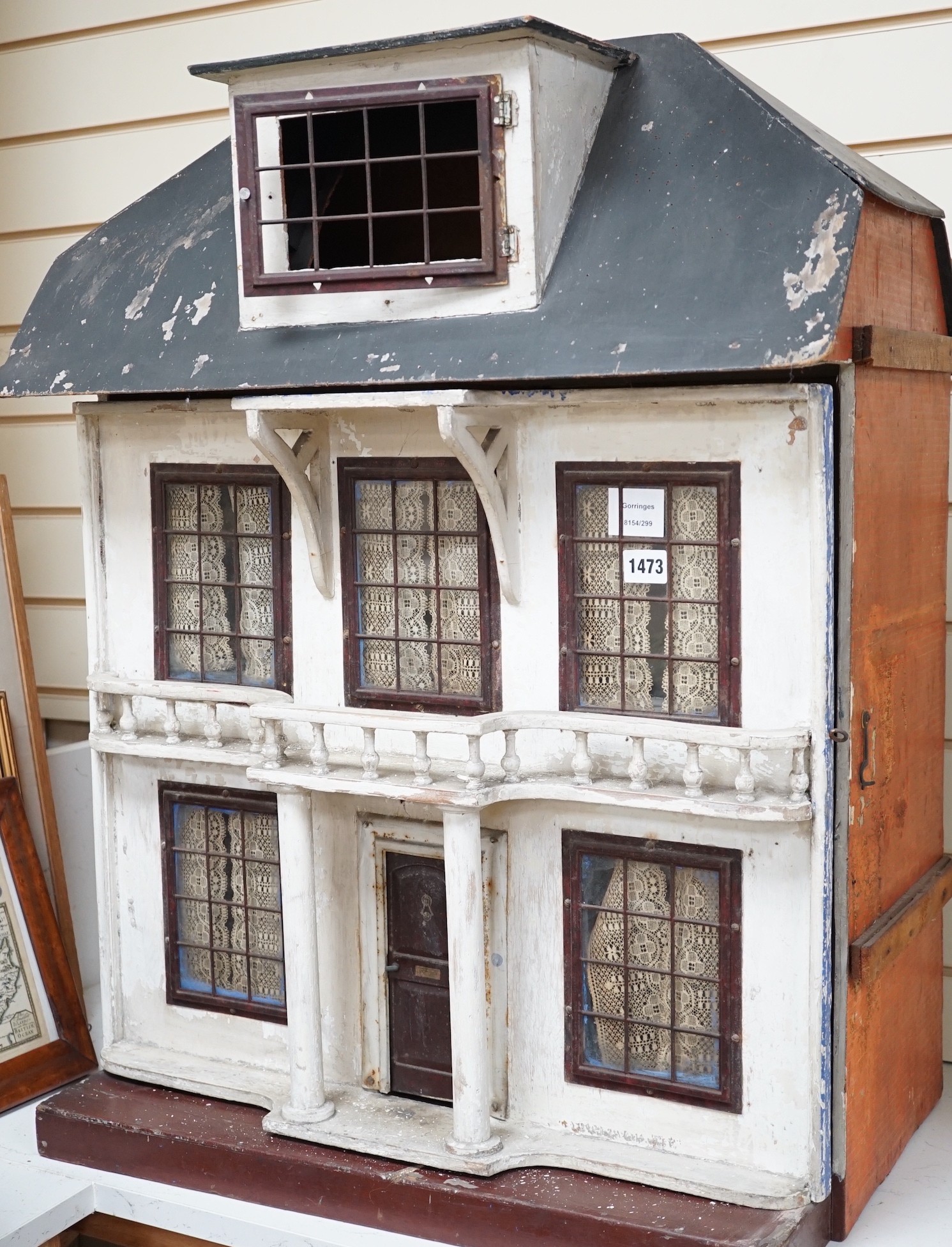 An early 20th century Lines Bros doll’s house, 81cms high x 64cms wide                                                                                                                                                      