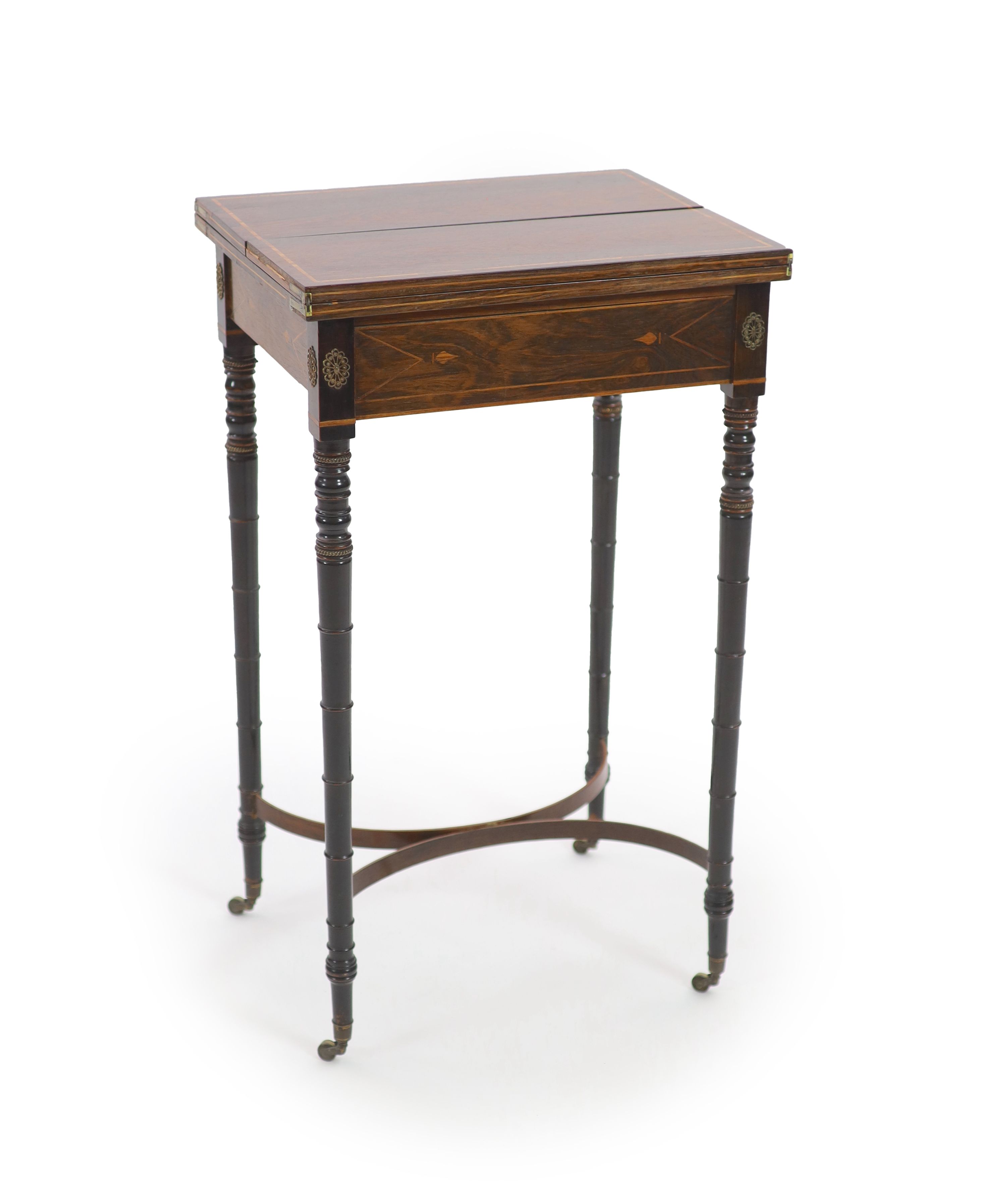 A Regency inlaid rosewood and ebony writing table, W.46cm D.37cm H.78cm                                                                                                                                                     