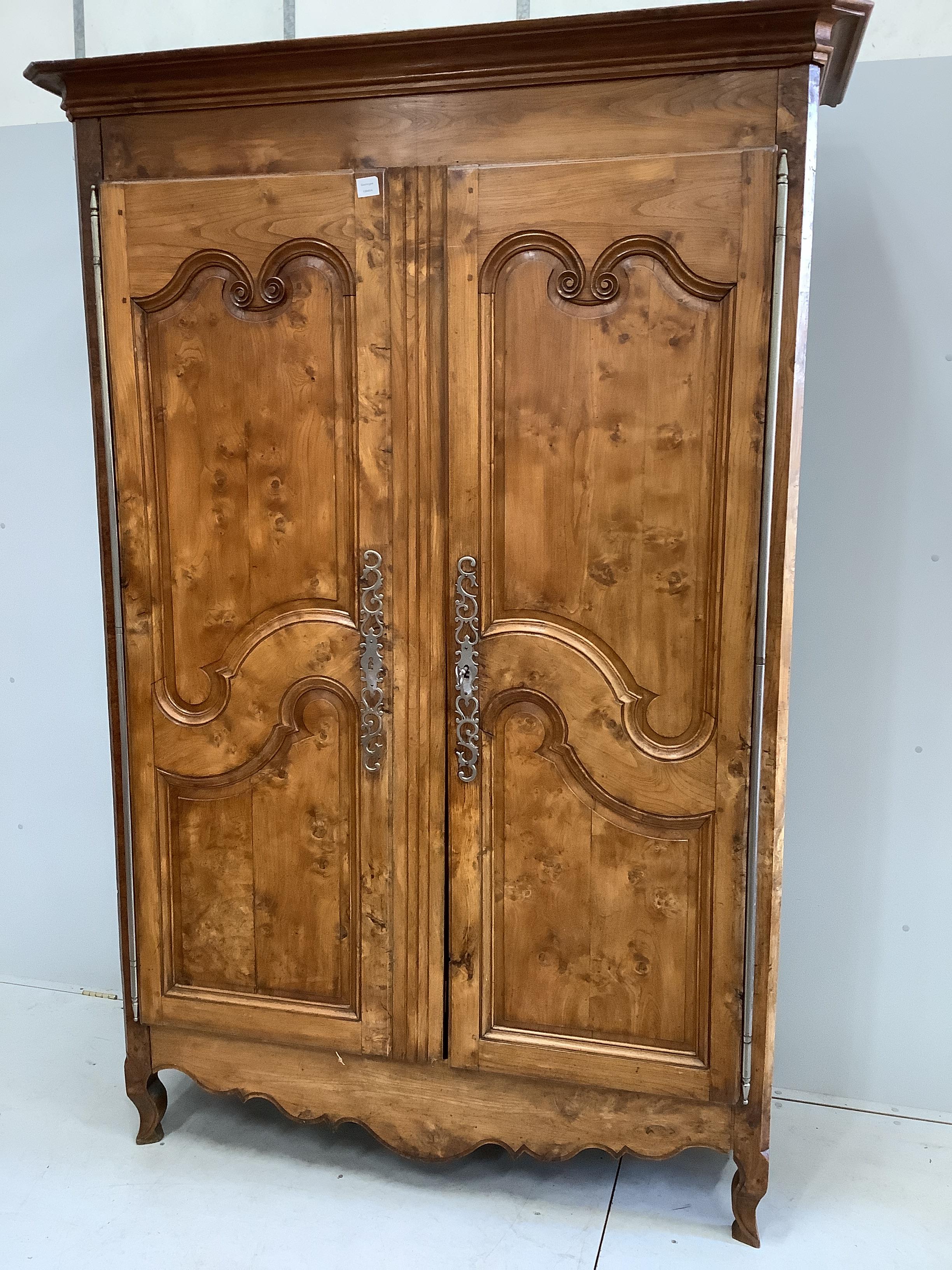 A tall Louis XV style carved chestnut two door armoire, width 156cm, depth 62cm, height 227cm                                                                                                                               