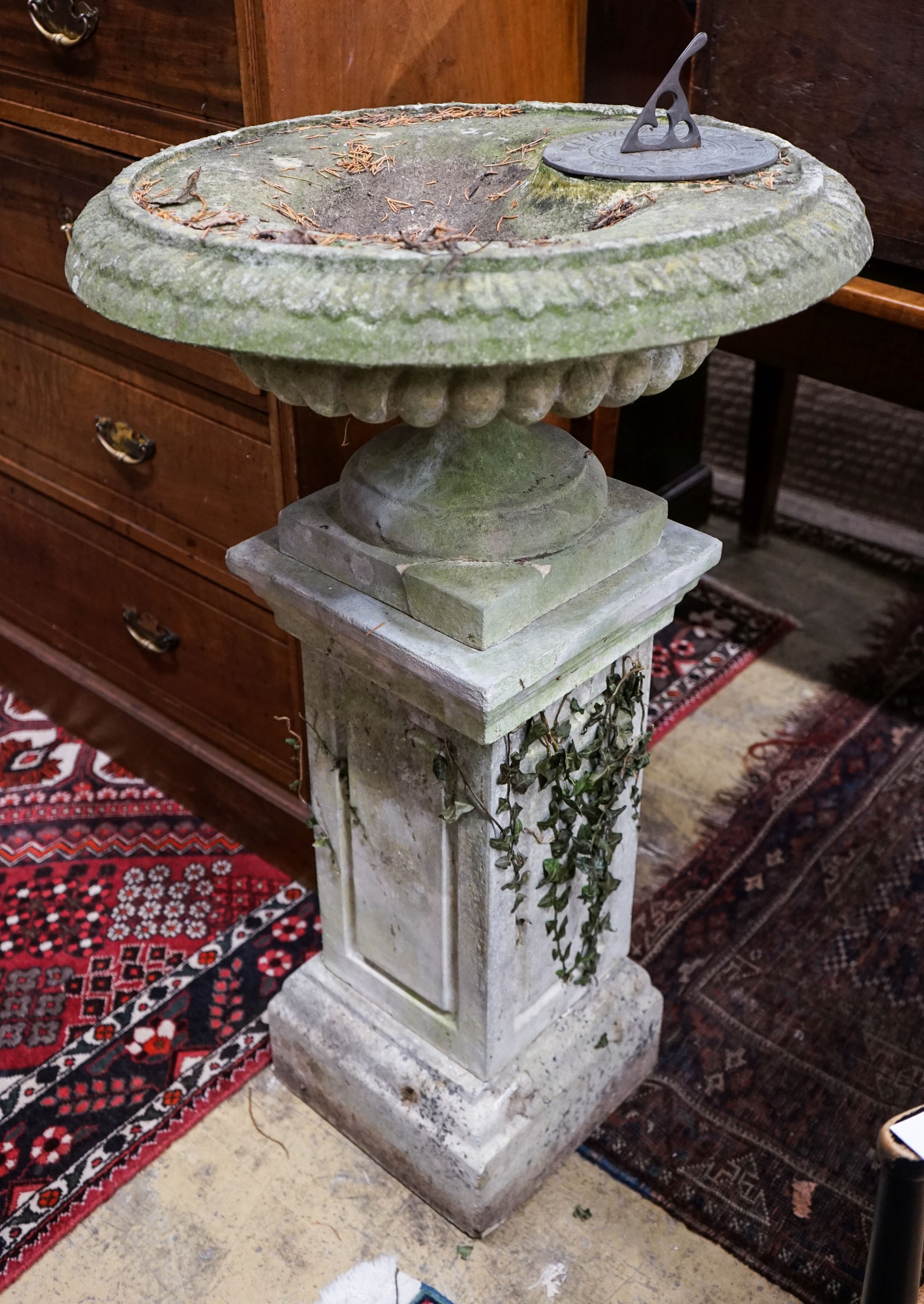 A reconstituted stone garden bird bath / sundial on square pedestal, height 110cm (a.f.)                                                                                                                                    
