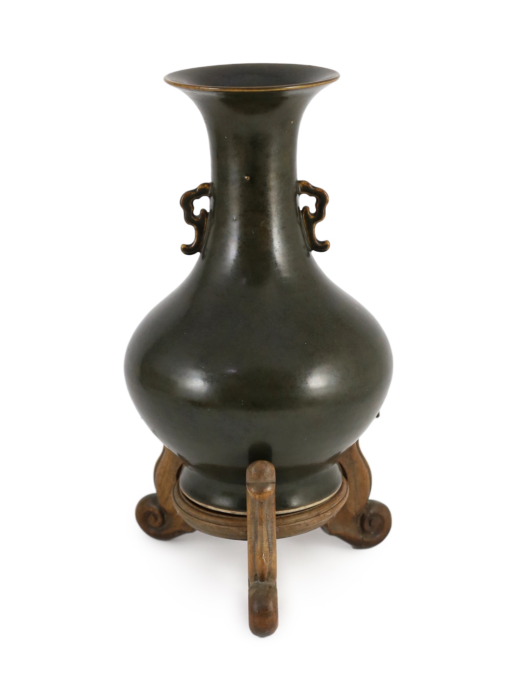A Chinese Jian style brown glazed vase, hu, 18th/19th century, 31.5cm high, cracked, wood stand                                                                                                                             