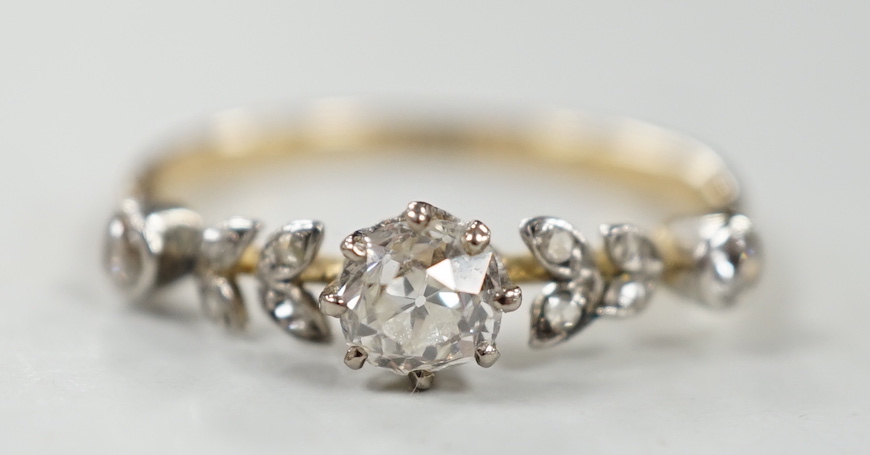 An 18ct and diamond cluster set half hoop ring, of foliate design, size N, gross weight 2.3 grams.                                                                                                                          