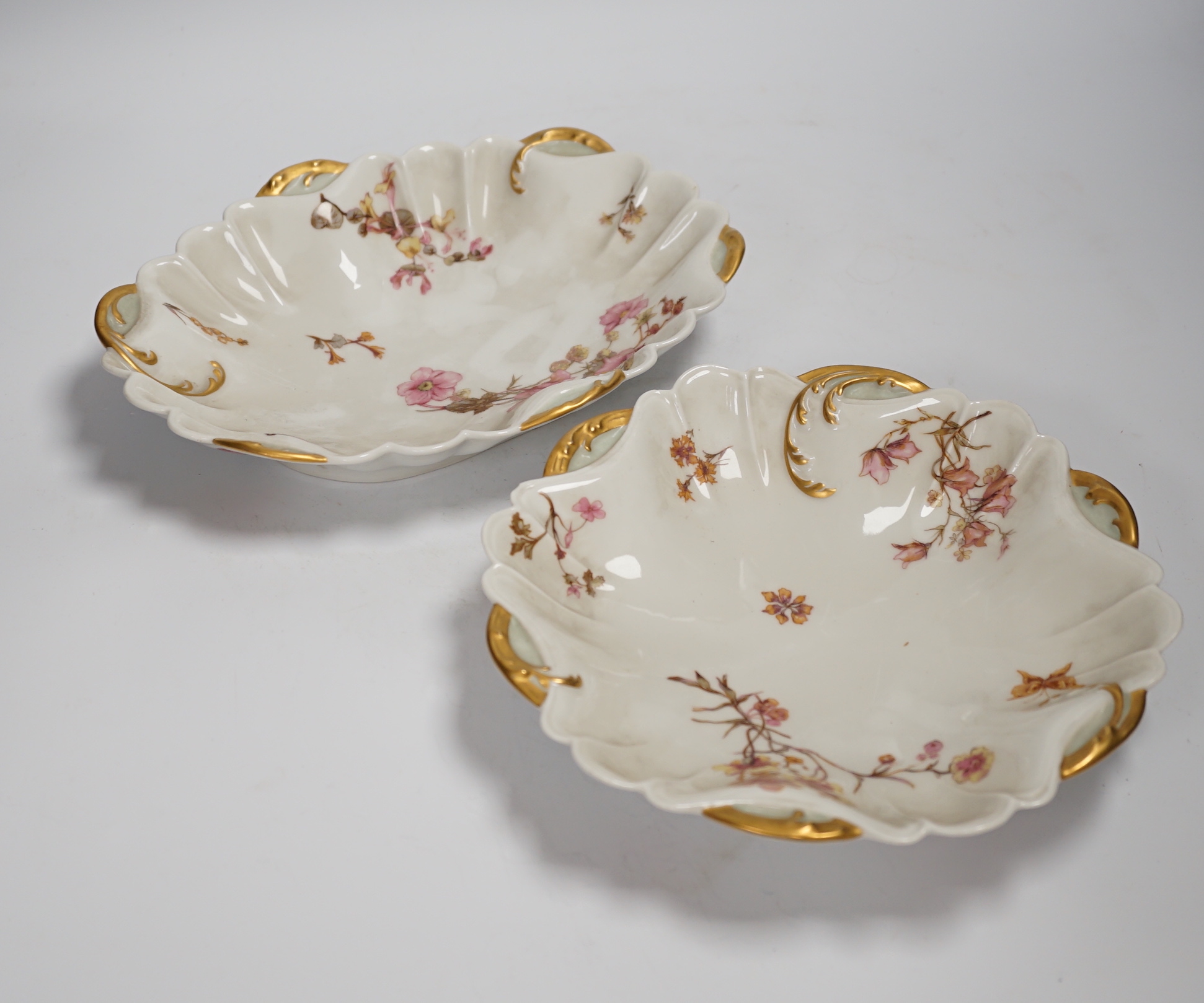 A Limoges floral eight piece dessert service with gilt decoration, 26cm wide                                                                                                                                                