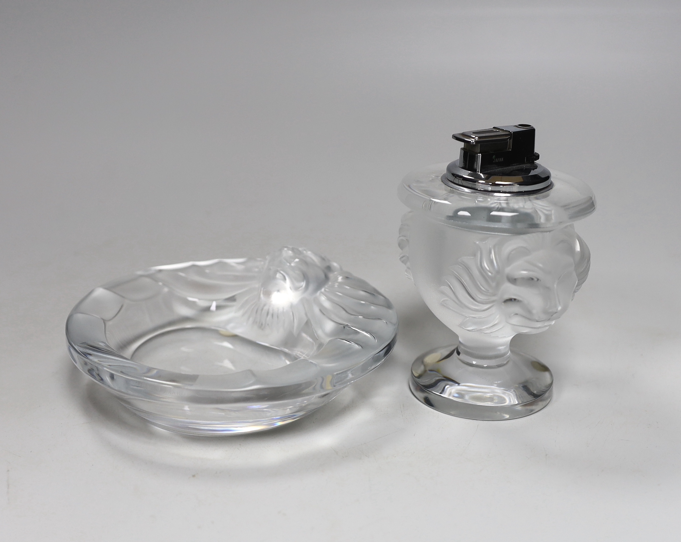 A Lalique glass tete de lion lighter and ashtray, lighter 12cm high (2)                                                                                                                                                     