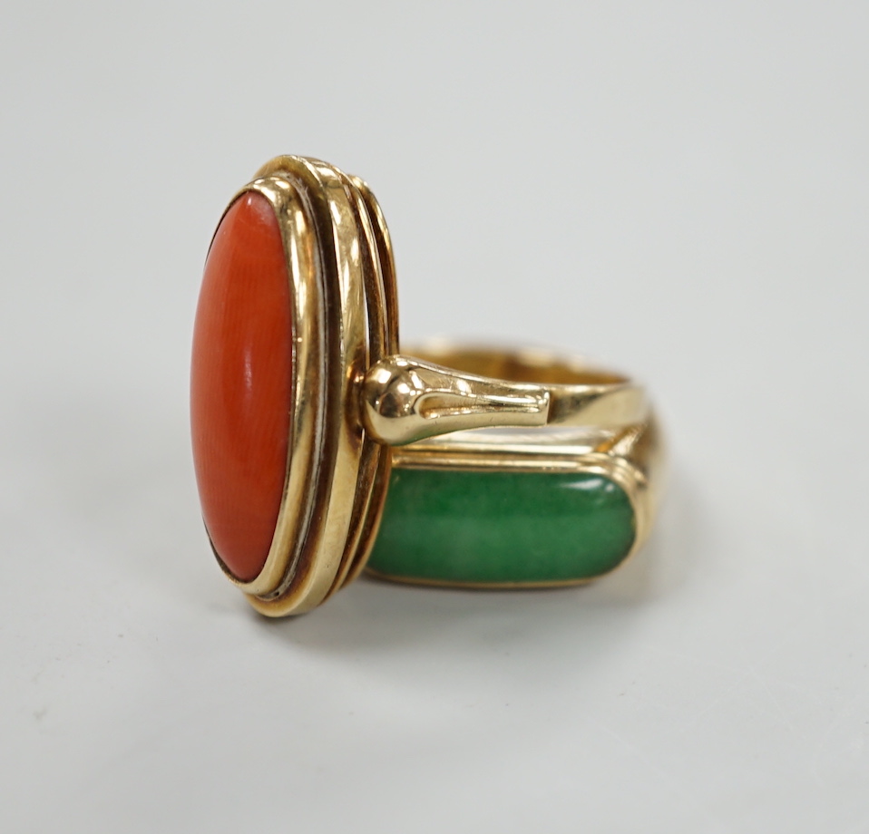 A 14ct and coral set oval ring, size O/P and a 14k and cabochon jade set ring, size P, gross weight 10.3 grams.                                                                                                             