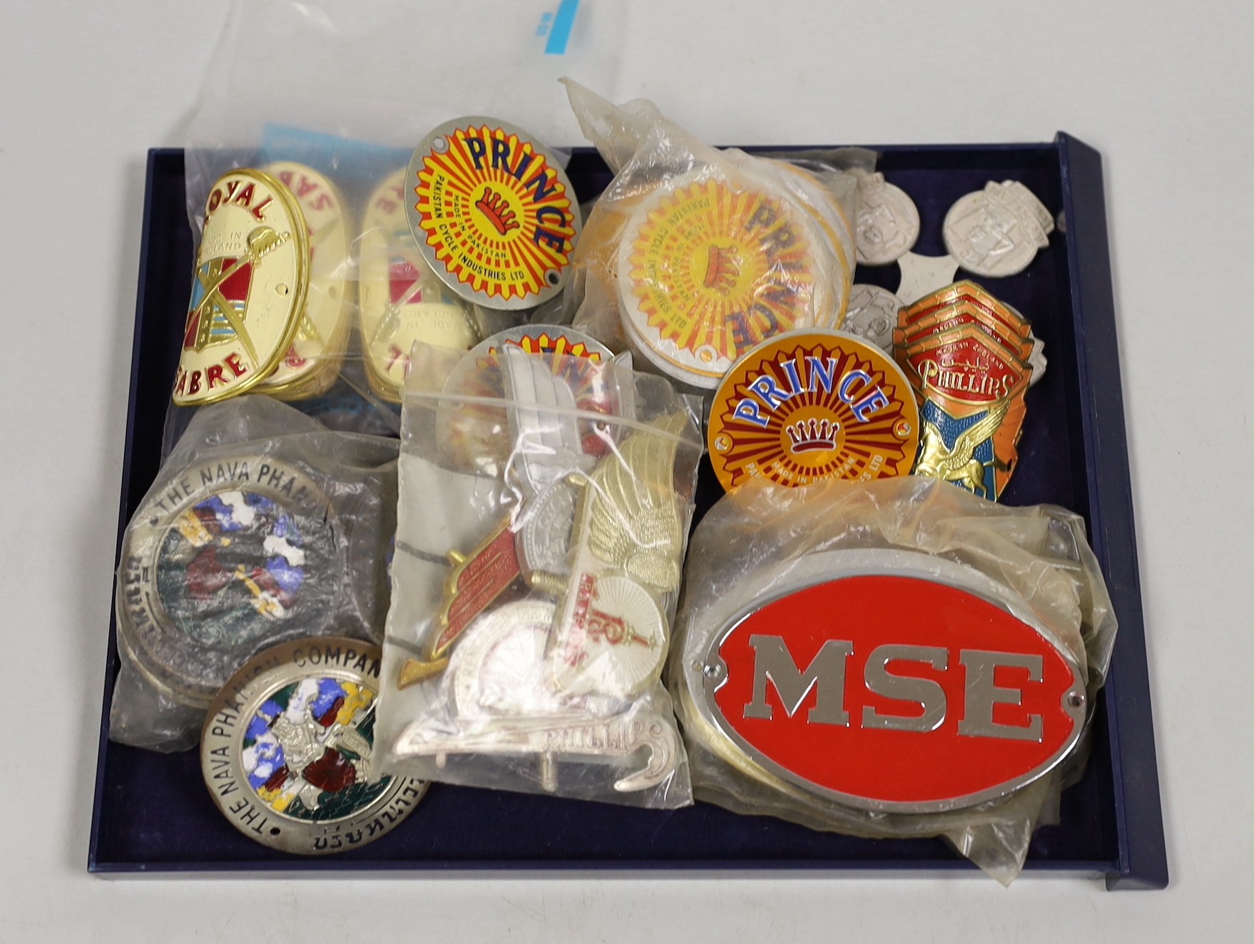 Cycling ephemera - a group of 'new old stock’ vintage bicycle badges, Phillips, Norman, Royal Sabre, Nava Phanick Co etc                                                                                                    
