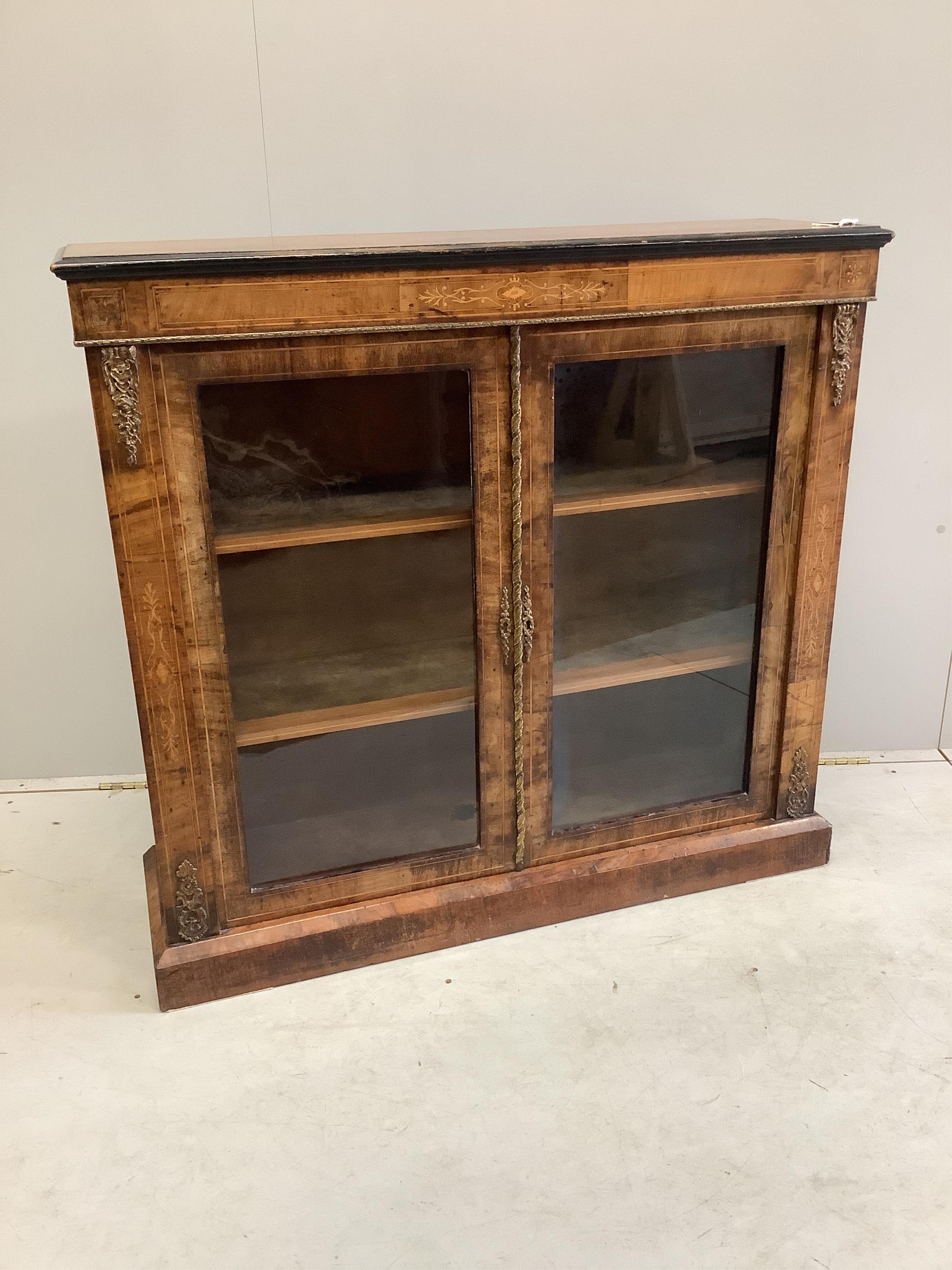 A late Victorian gilt metal mounted inlaid walnut pier cabinet, width 106cm, depth 31cm, height 99cm. Condition - fair                                                                                                      