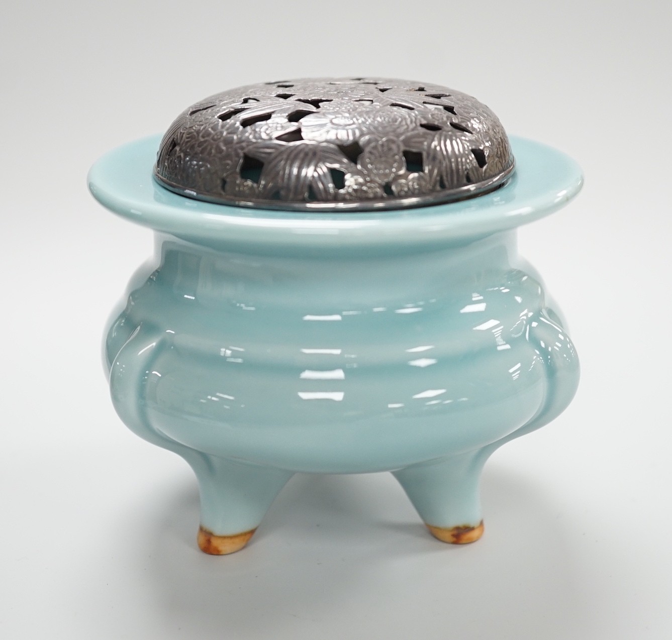 A Chinese tripod censer with white metal cover, Chinese mark. 9cm tall                                                                                                                                                      