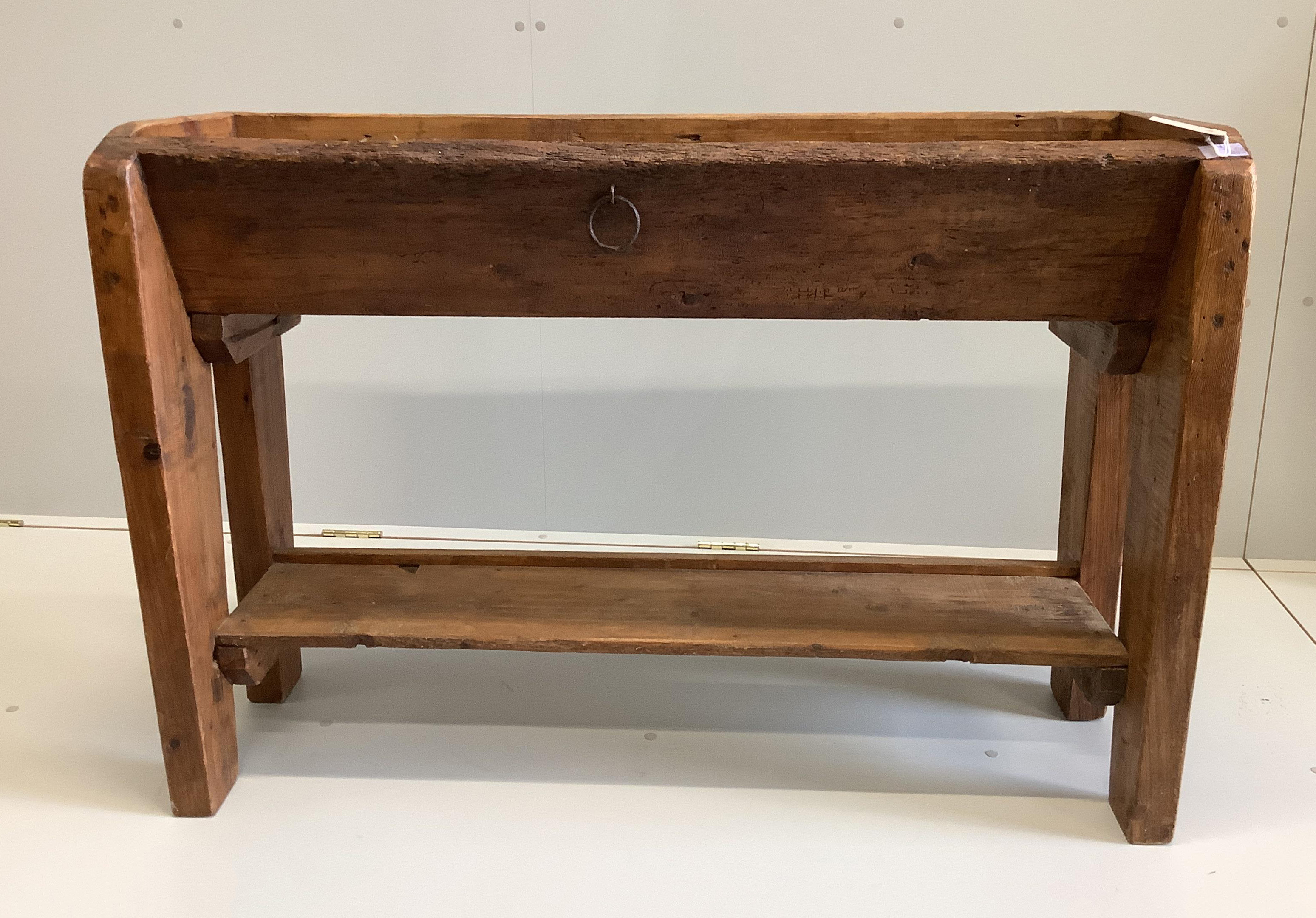 A French provincial pine and fruitwood trough, width 114cm, depth 38cm, height 79cm                                                                                                                                         
