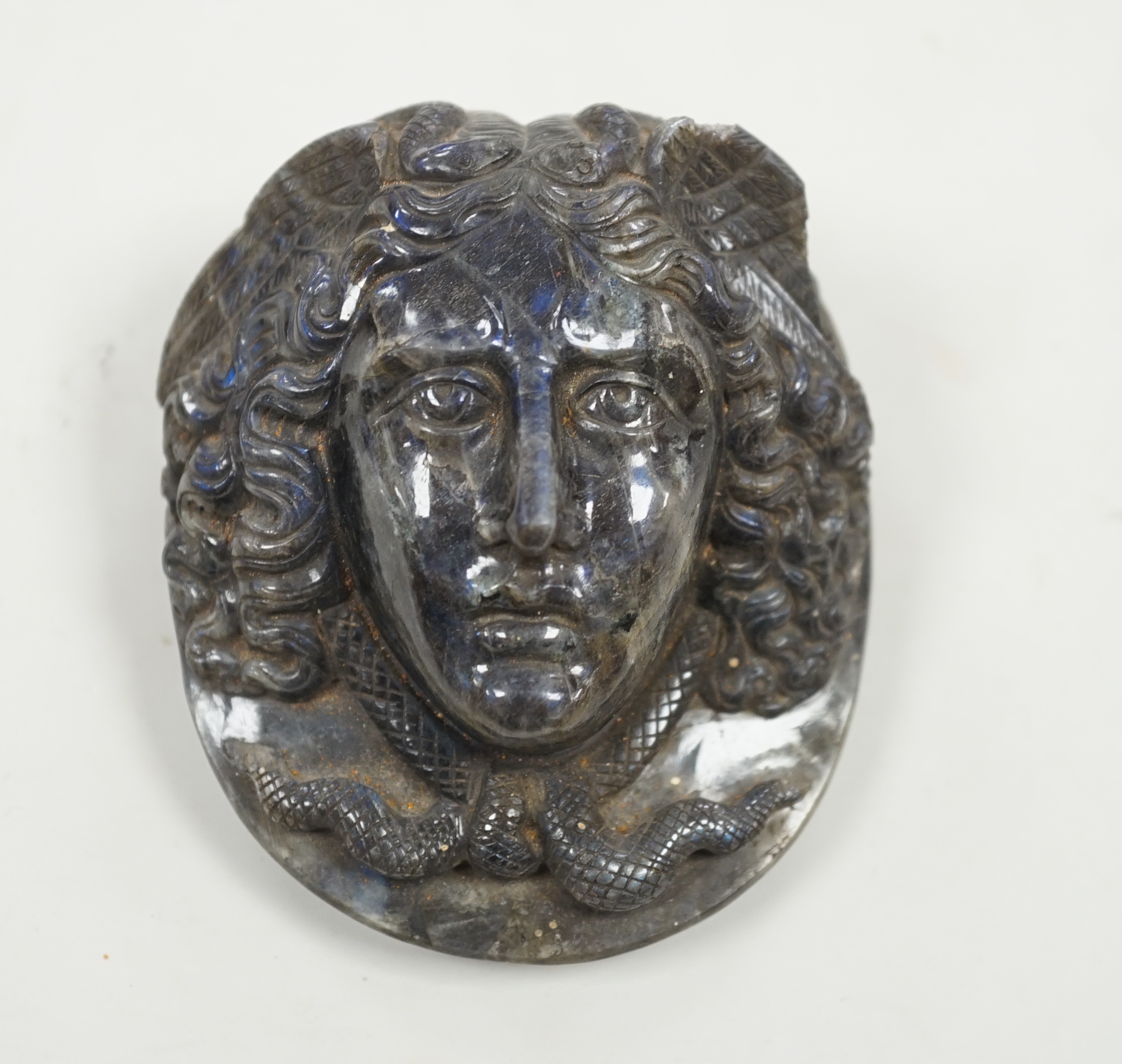 A carved labradorite paperweight with the head of Medusa, After the Antique, 8cm                                                                                                                                            