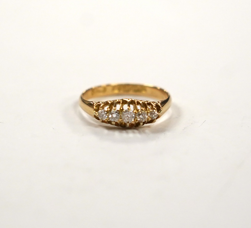 An Edwardian 18ct gold and graduated five stone set diamond ring, size M, gross weight 3 grams.                                                                                                                             