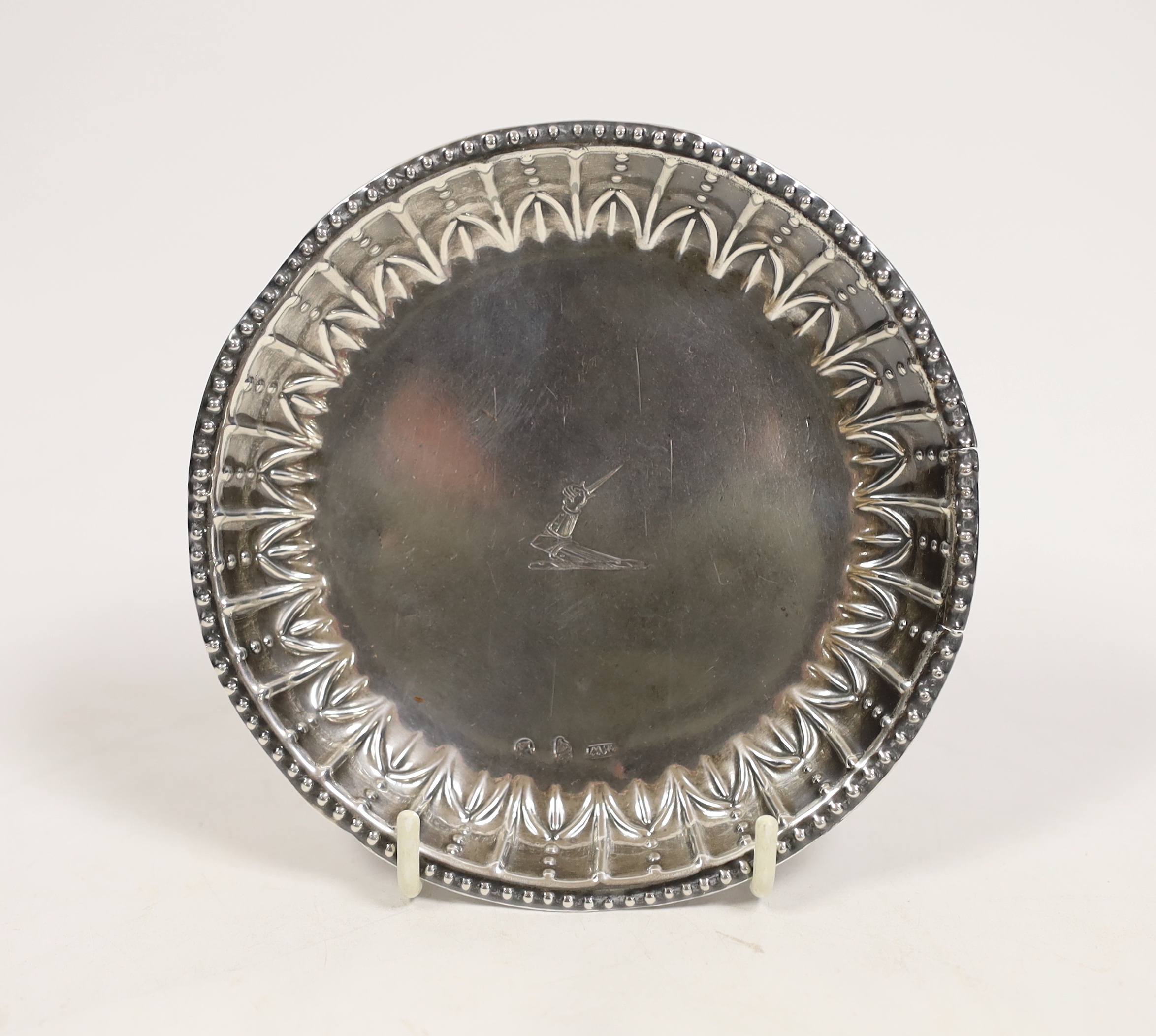 A George III Irish silver small dish, with repousse border and engraved crest, by Matthew West, Dublin, circa 1780, 12.1cm, 2,6oz.                                                                                          