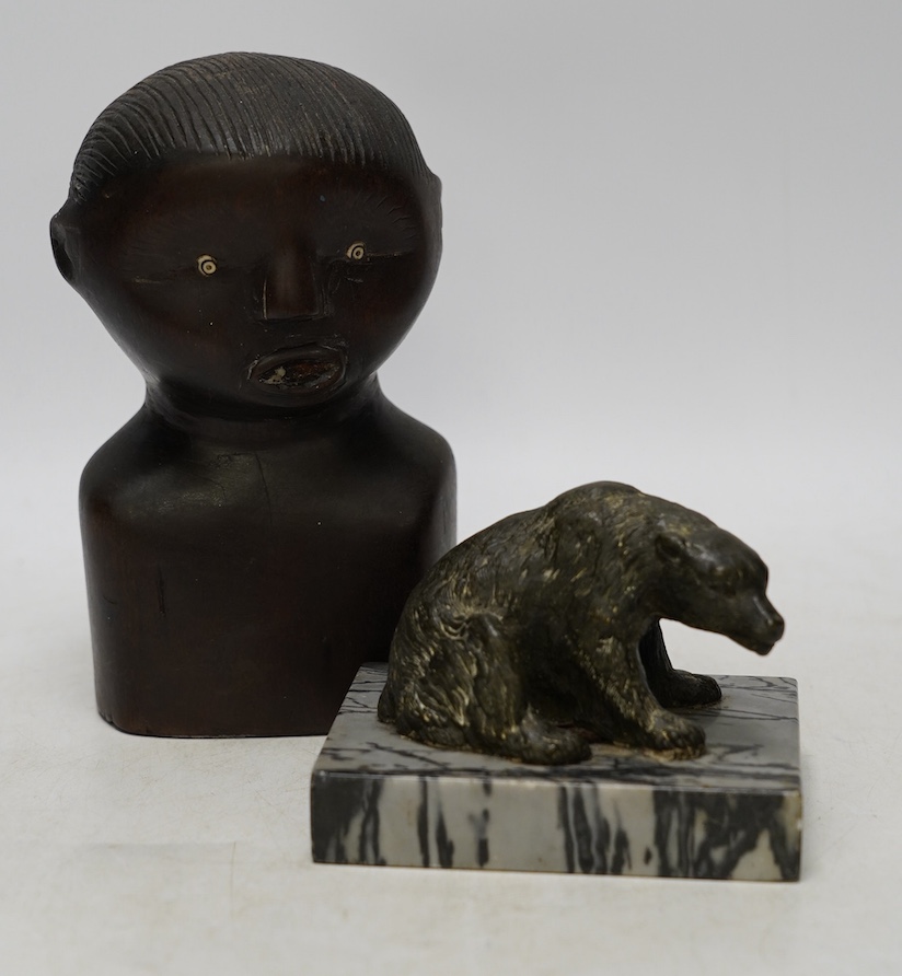 A bronze polar bear paperweight and an African tribal carved wood bust, 17cm high. Condition - fair, some splits to the bust                                                                                                