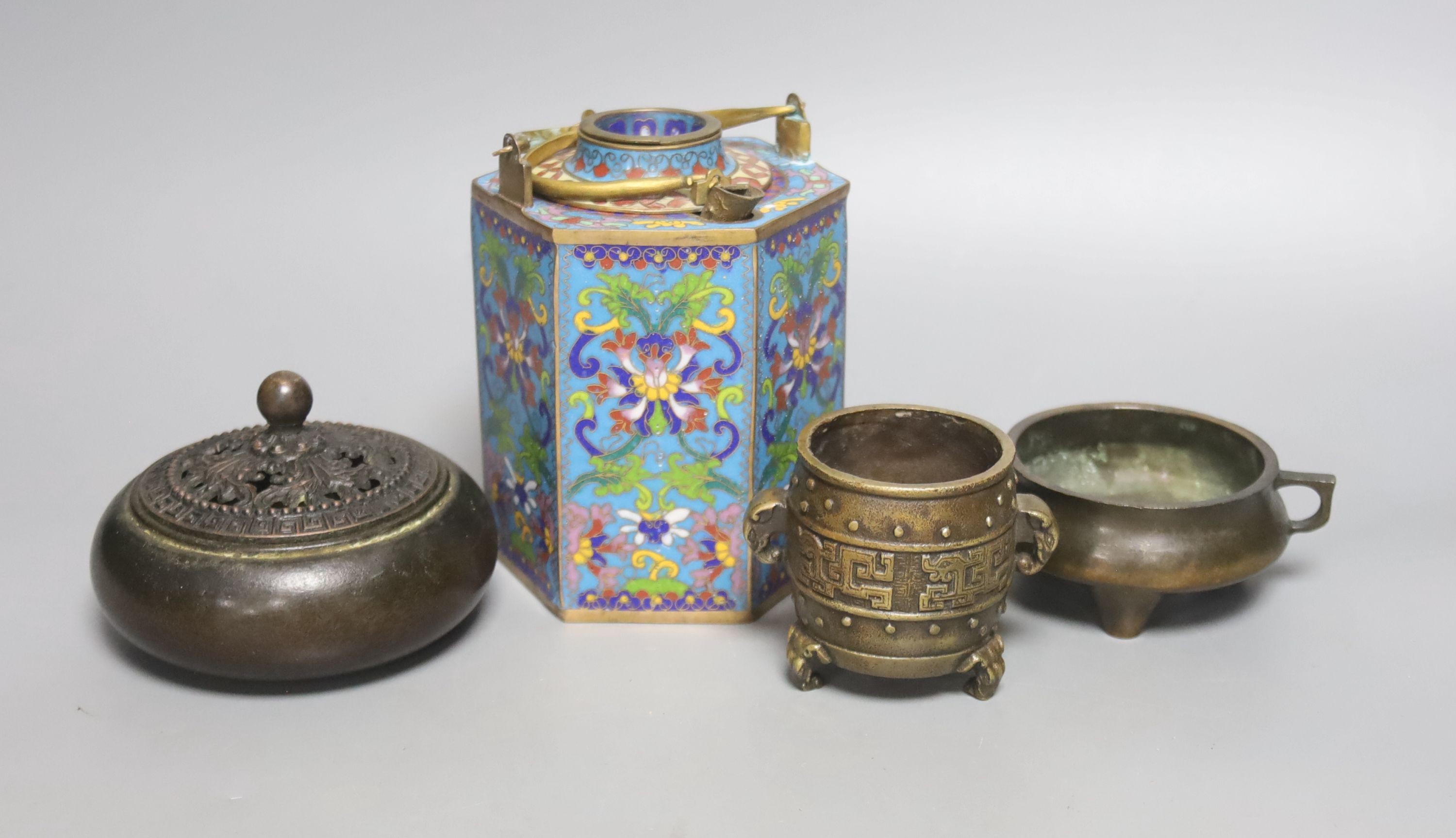 A Chinese small bronze tripod censer, a Chinese archaistic bronze tripod vessel, a bronze jar and cover and a cloisonné enamel wine warming pot                                                                             